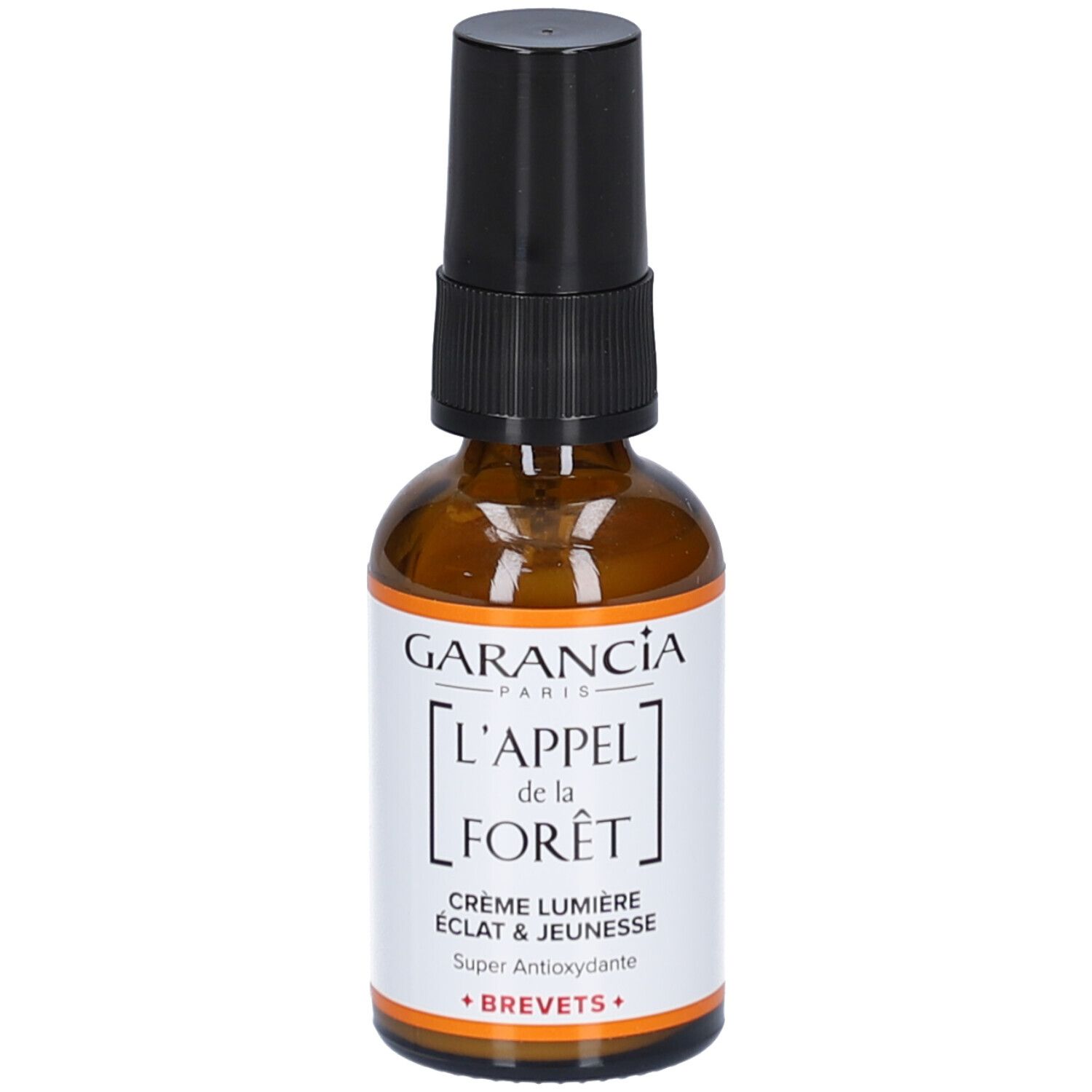 Flacon en verre brun avec pompe noire. Étiquette avec texte: GARANCIA, L'APPEL de la FORÊT, Crème Lumière, Éclat & Jeunesse, Super Antioxydante.