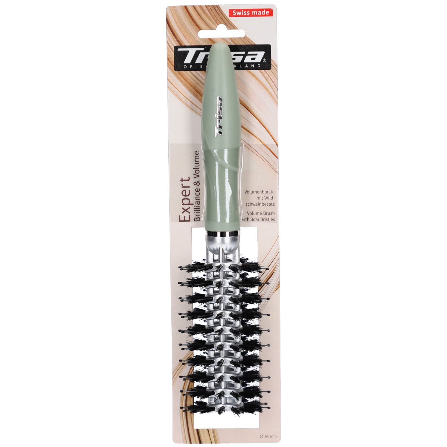 Brosse ronde avec manche vert et poils. Emballage avec nom et logo du produit. Label "Swiss made".