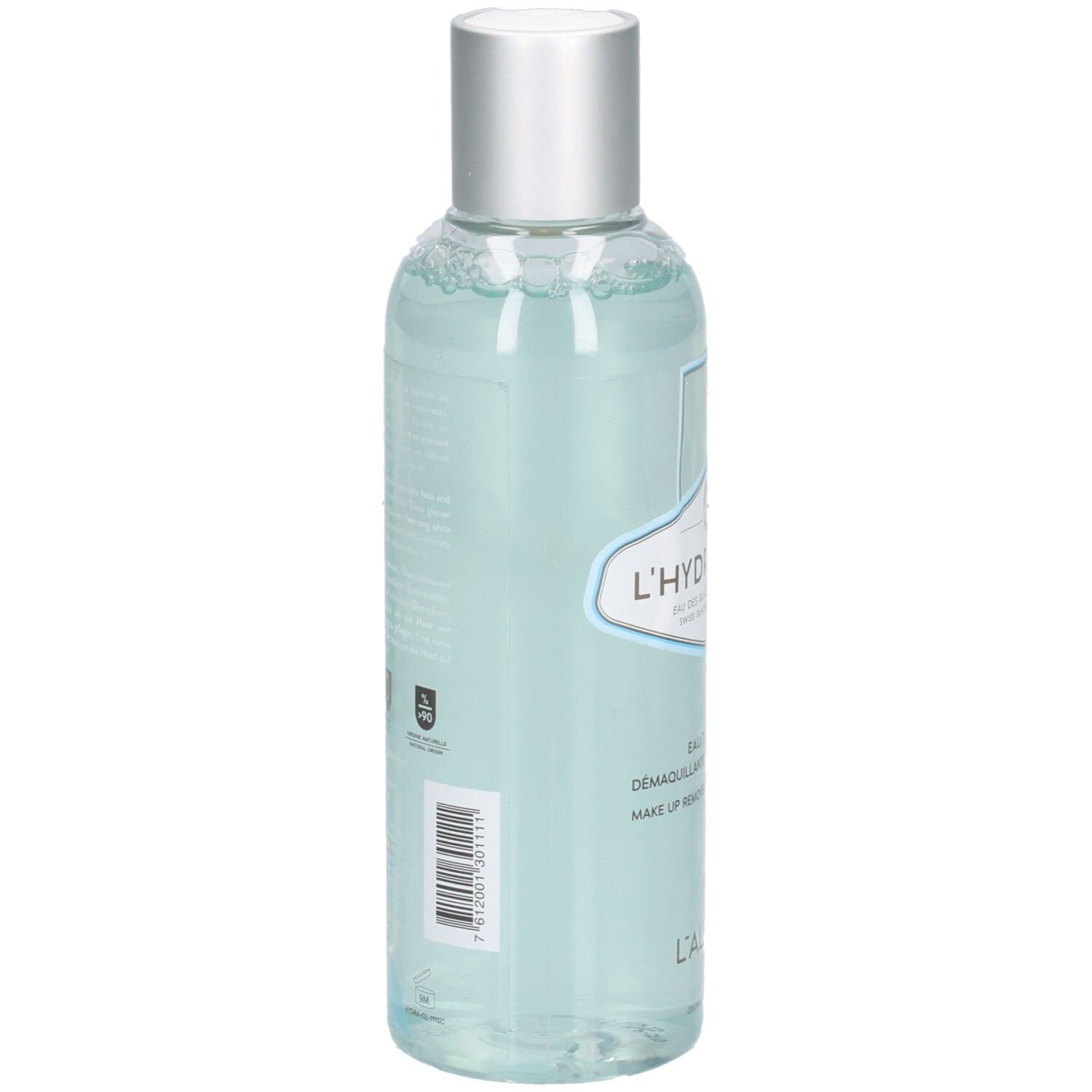 Vue arrière d'un flacon transparent avec bouchon argenté. Étiquette avec texte et code-barres. Liquide bleu visible.