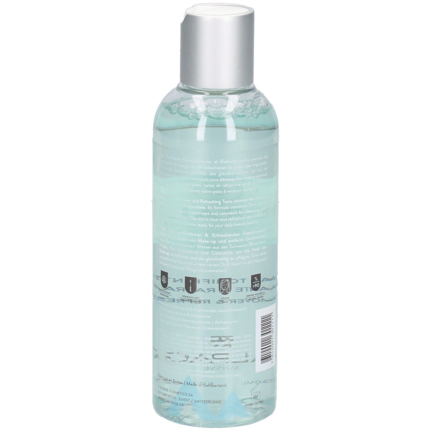 Vue arrière d'un flacon transparent avec bouchon argenté. Étiquette avec texte. Liquide bleu visible.