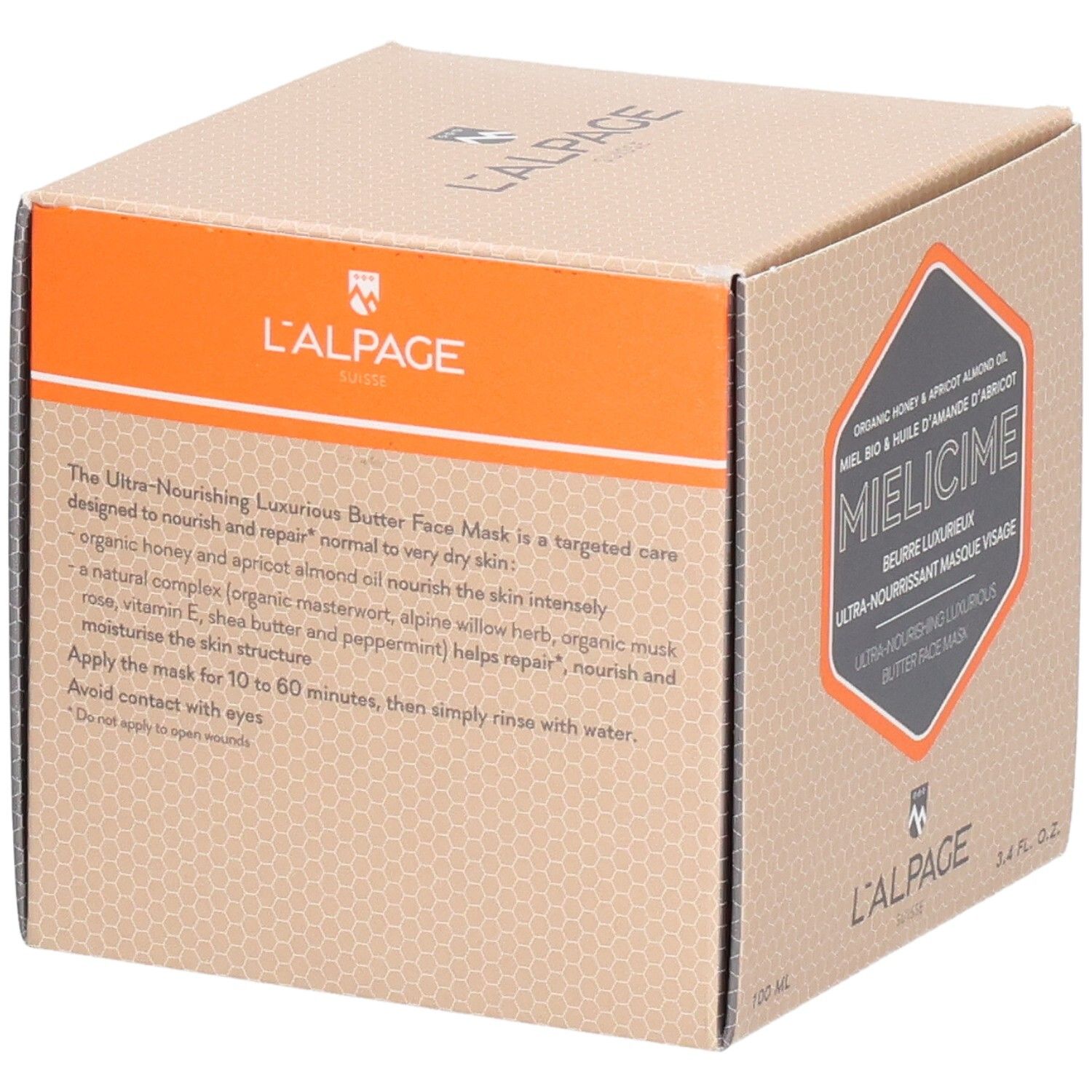 Boîte en carton avec description du produit. Accent orange. Texte : Masque visage ultra-nourrissant. Marque : L'ALPAGE.