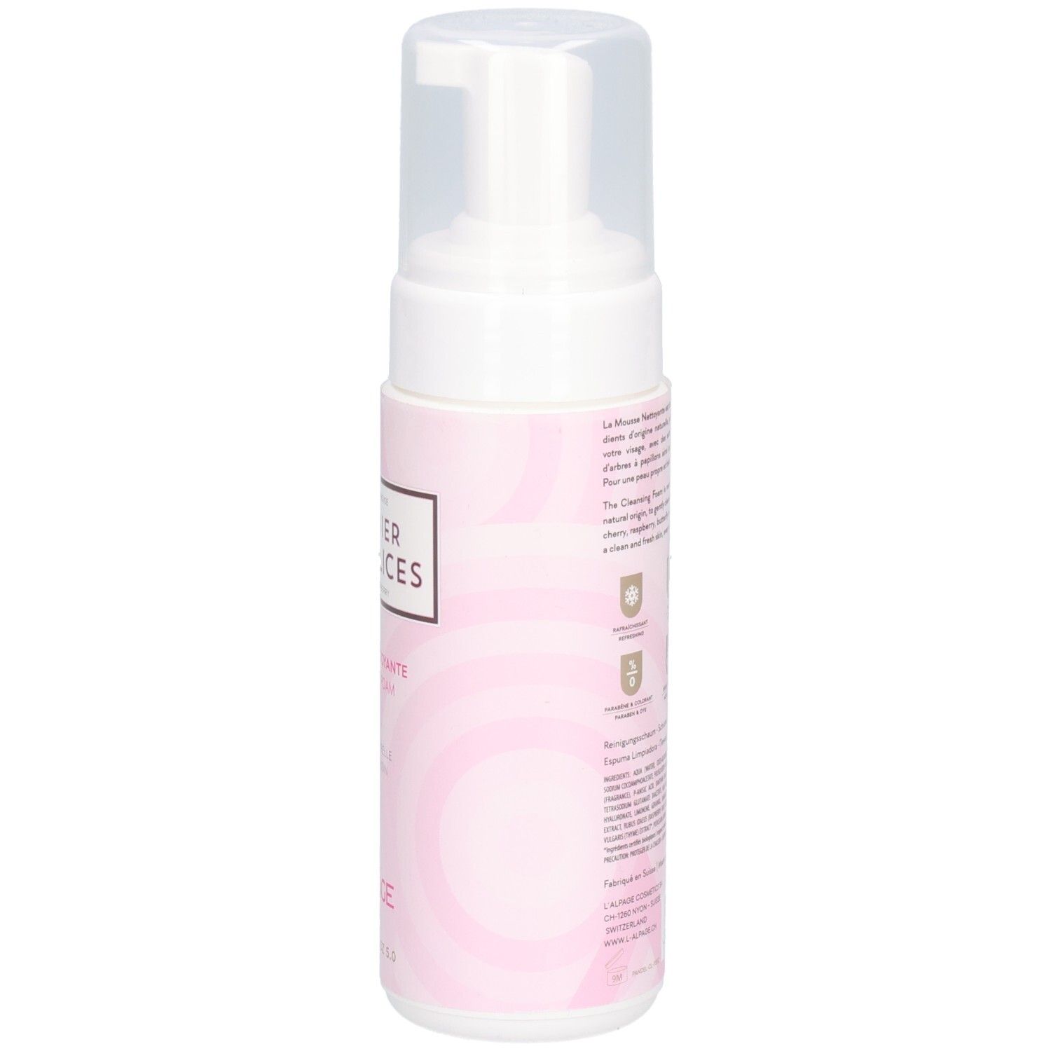 Flacon de mousse nettoyante, vue latérale. Distributeur blanc avec bouchon transparent. Étiquette rose avec texte.