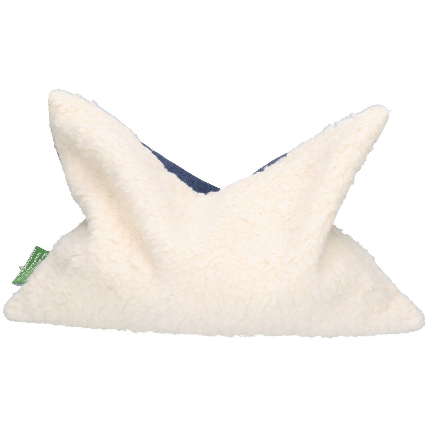 Coussin aux noyaux de cerise avec extérieur doux en polaire teddy crème et intérieur en tissu bleu. Motif étoiles visible.