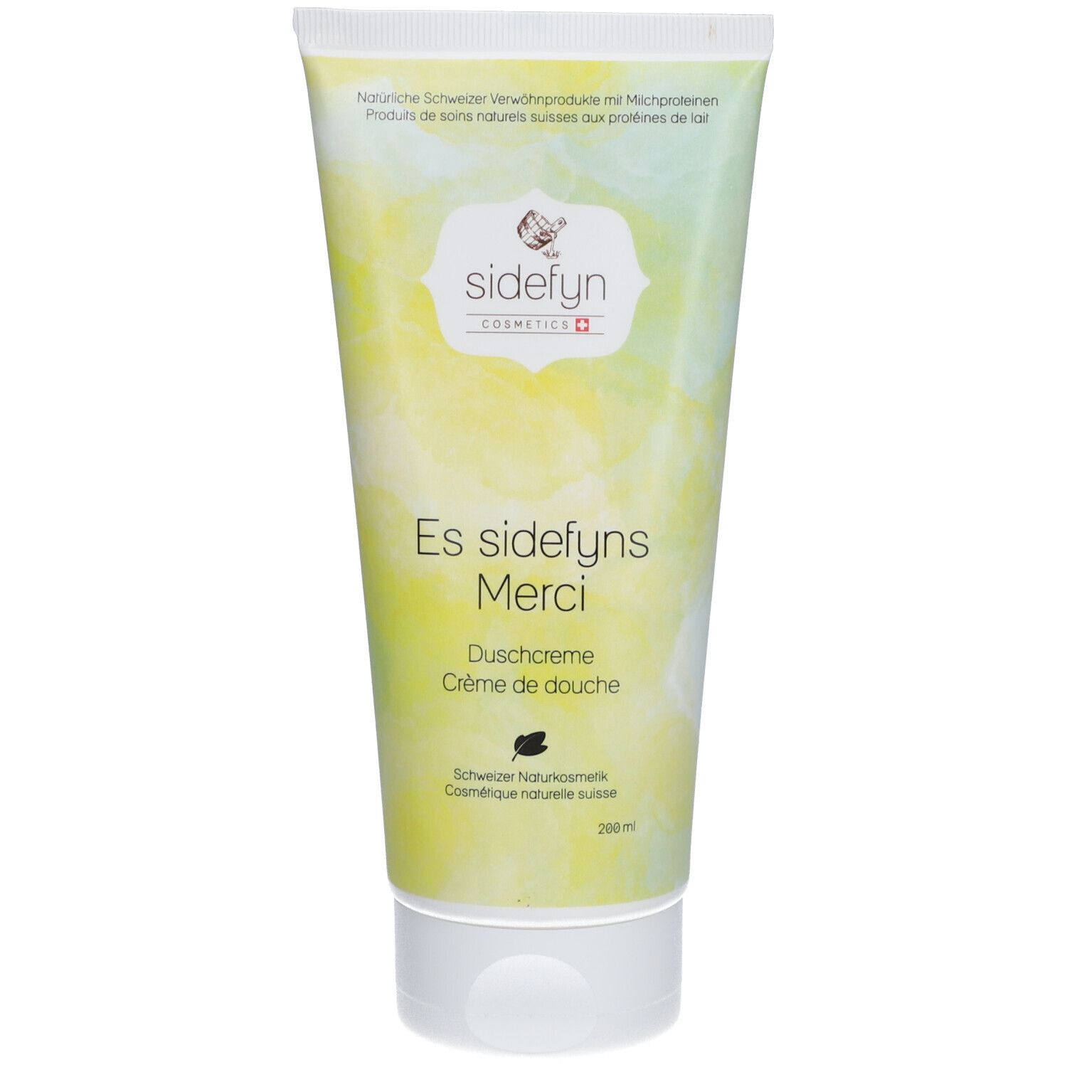 Tube de crème de douche Sidefyn. Bouchon blanc, fond jaune-vert. Inscription : Es sidefyns Merci, crème de douche, cosmétiques naturels suisses.