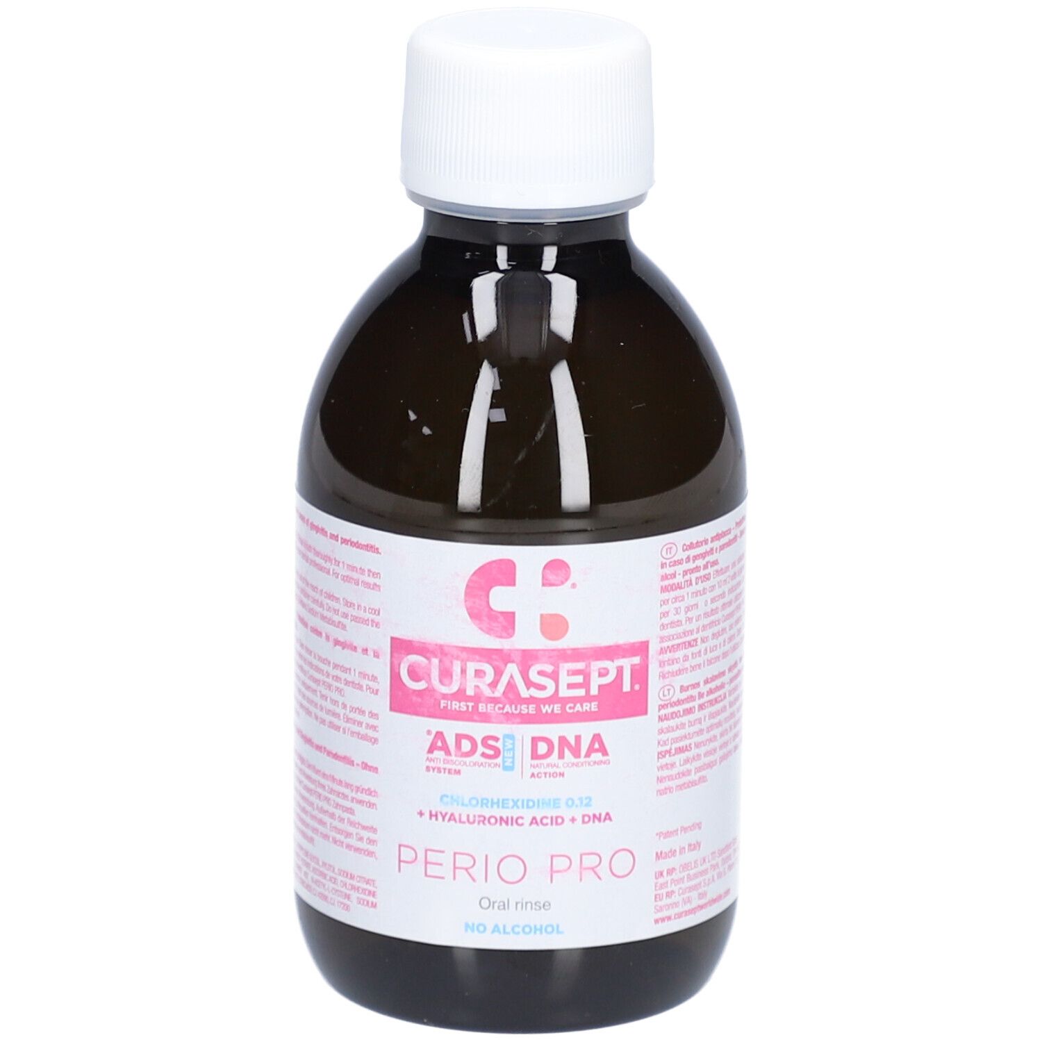 Flacon brun avec bouchon blanc. Étiquette rose avec texte: CURASEPT, ADS DNA, PERIO PRO, Chlorhexidine 0,12, Acide hyaluronique + ADN, sans alcool.