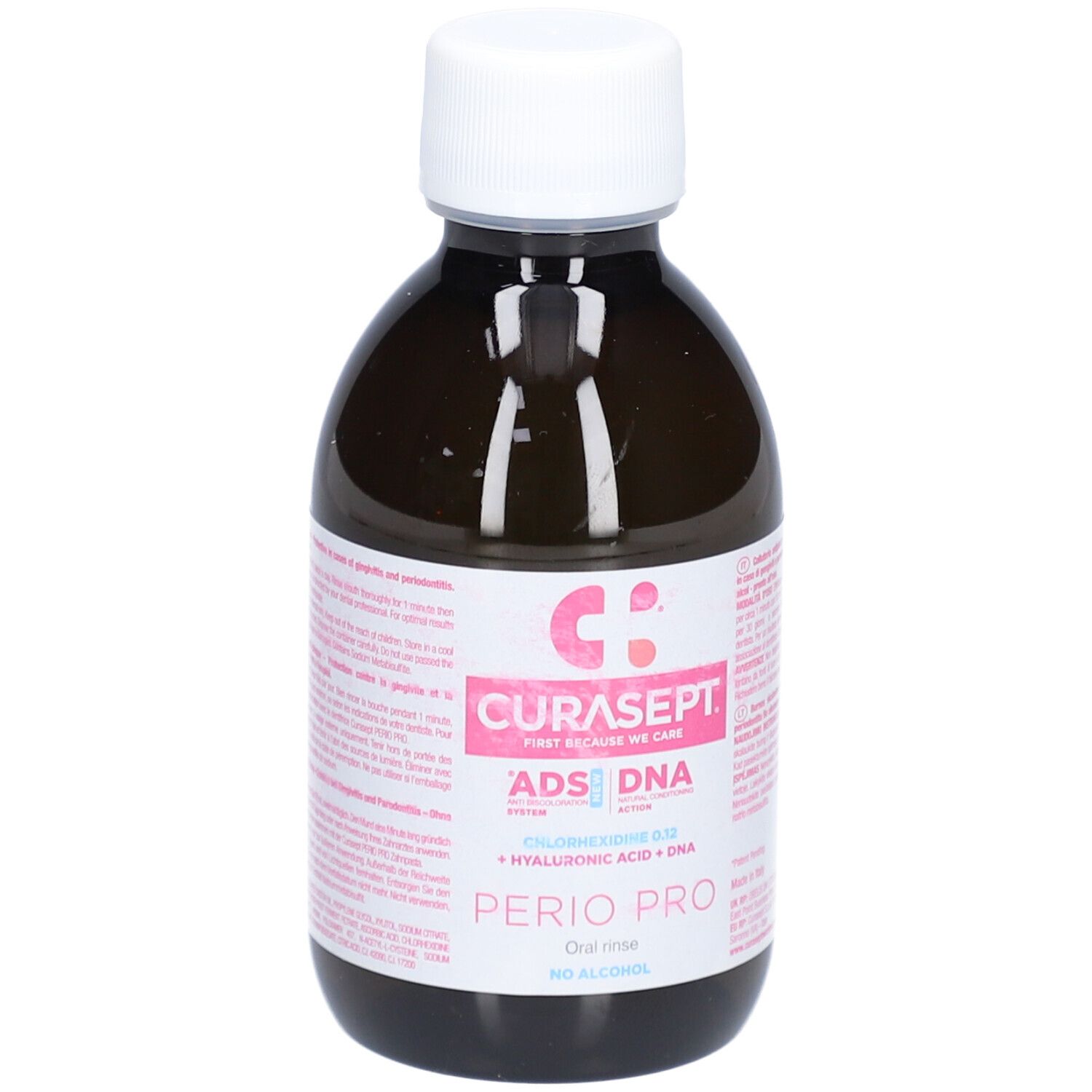 Flacon brun avec bouchon blanc. Étiquette rose avec texte: CURASEPT, ADS DNA, PERIO PRO, Chlorhexidine 0,12, Acide hyaluronique + ADN, sans alcool.