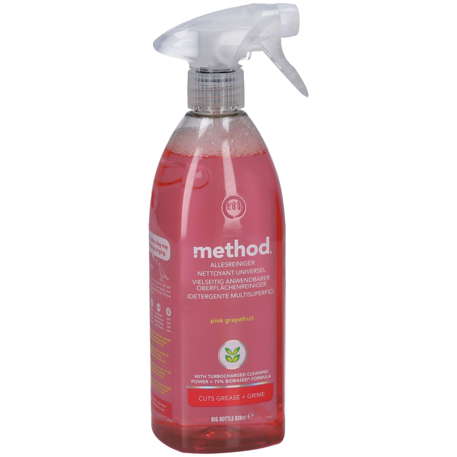 Nettoyant en spray rose avec tête de pulvérisation. Inscription : method, Pink Grapefruit. Bouteille remplie de liquide.