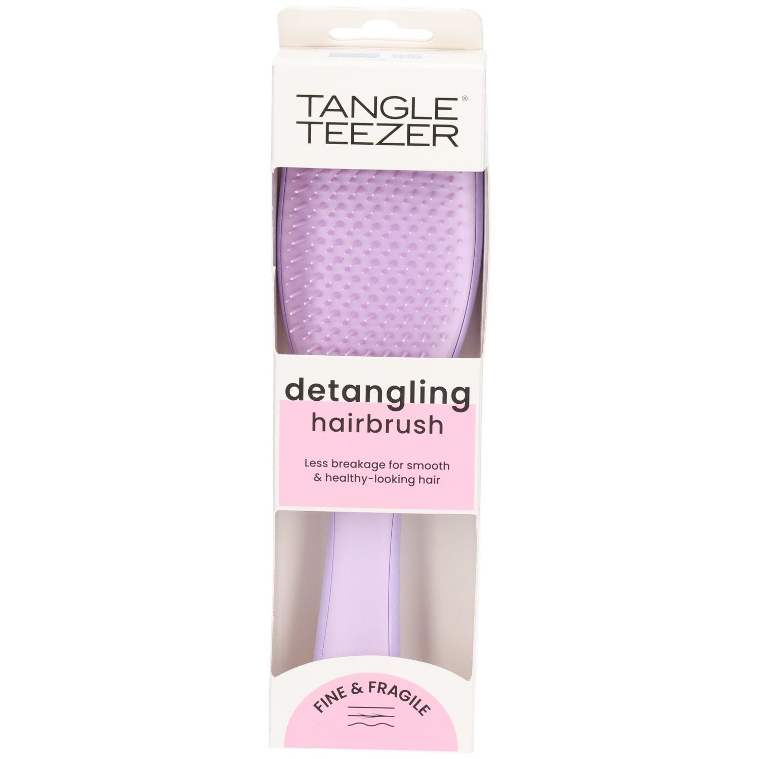 Brosse démêlante dans son emballage. Brosse violette avec manche. Marque : Tangle Teezer. Texte : Fine & Fragile.