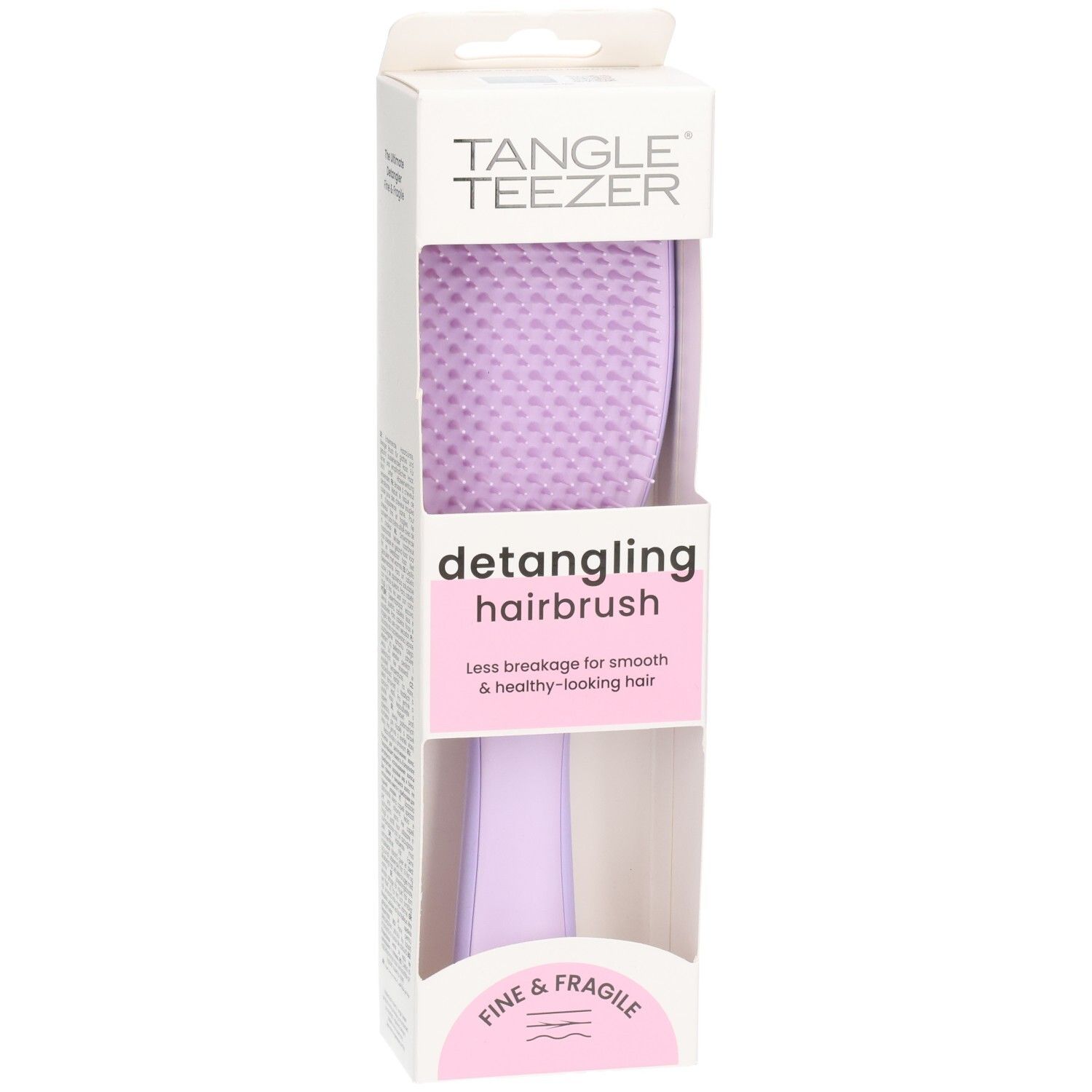Brosse démêlante dans son emballage. Brosse violette avec manche. Marque : Tangle Teezer. Texte : Fine & Fragile.