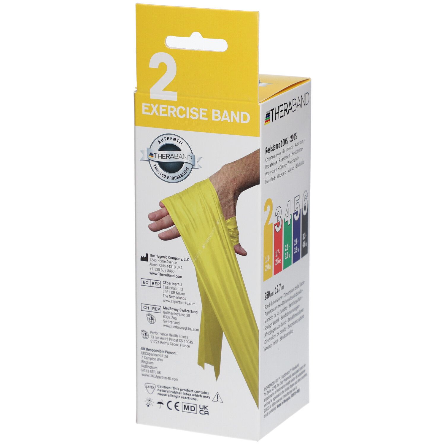 Emballage avec bande d'exercice jaune. Inscription : THERABAND, Exercise Band. Femme démontrant l'utilisation. Bande jaune autour de la main.