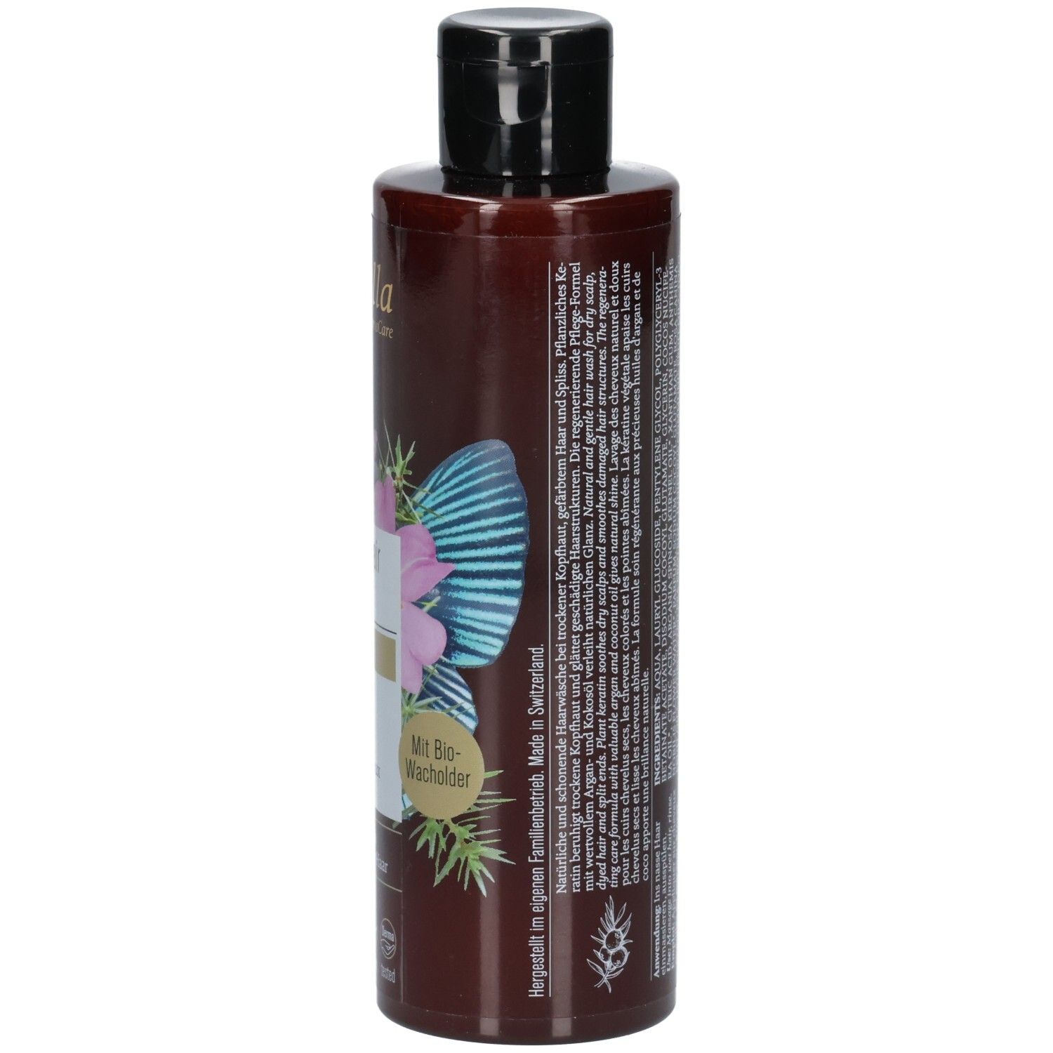 Flacon de shampooing brun, vue latérale. Inscription : Nutri Repair Shampoo, Phyto Keratin. Avec genièvre bio. Fabriqué en Suisse.