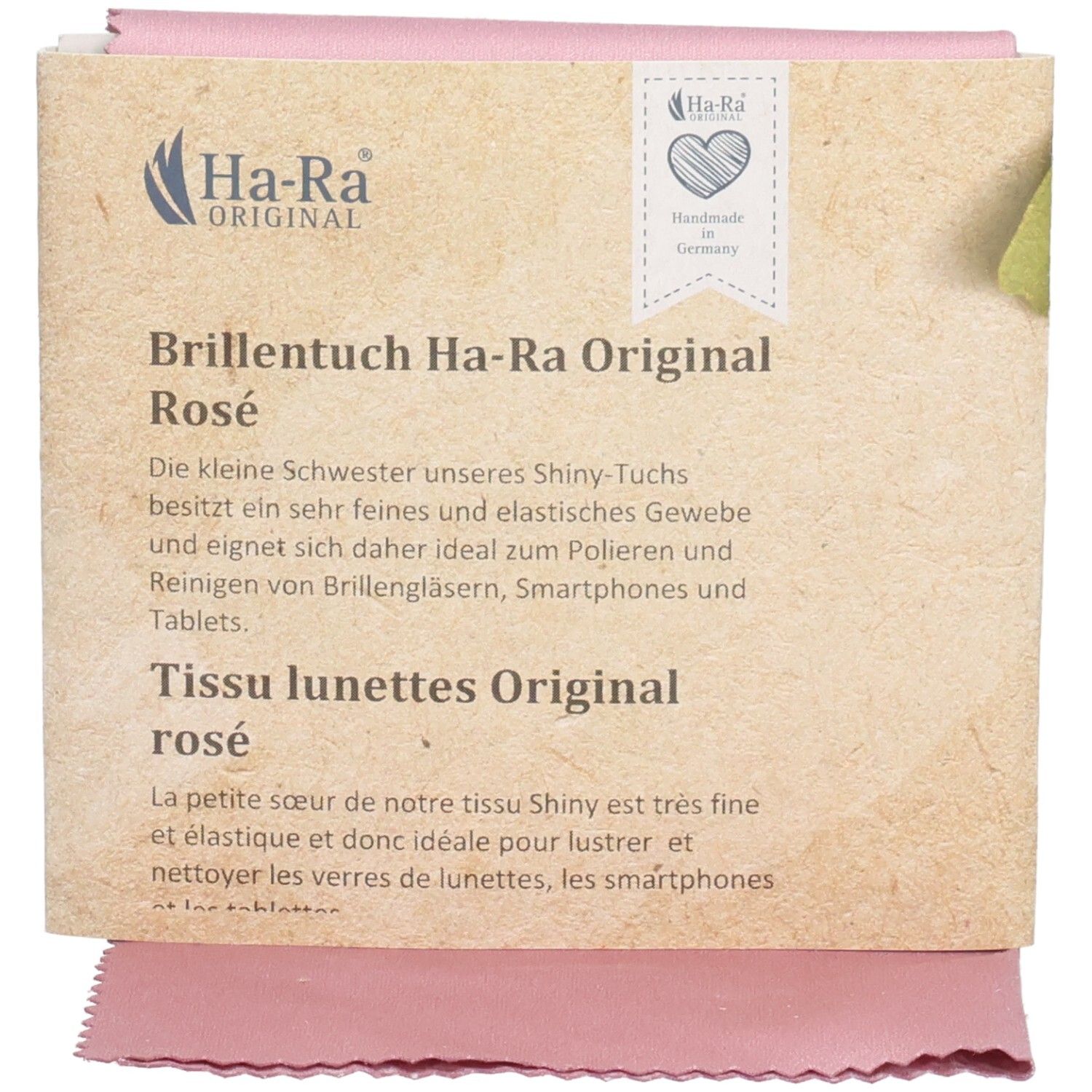 Chiffon rose pour lunettes avec emballage. Inscription: Ha-Ra Original. Fabriqué à la main en Allemagne. Texte en allemand et français.