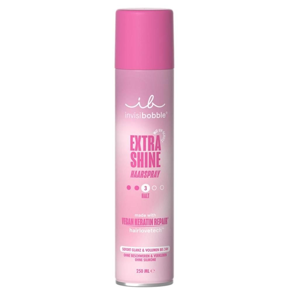Bombe de laque rose avec bouchon rose. Inscription: invisibobble, EXTRA SHINE HAARSPRAY, vegan keratin repair. 250 ml.