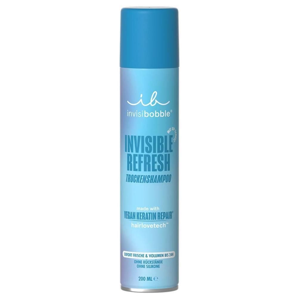 Flacon cylindrique bleu. Inscription: INVISIBOBBLE, INVISIBLE REFRESH Trockenshampoo. Vegan Keratin Repair. 200 ml.