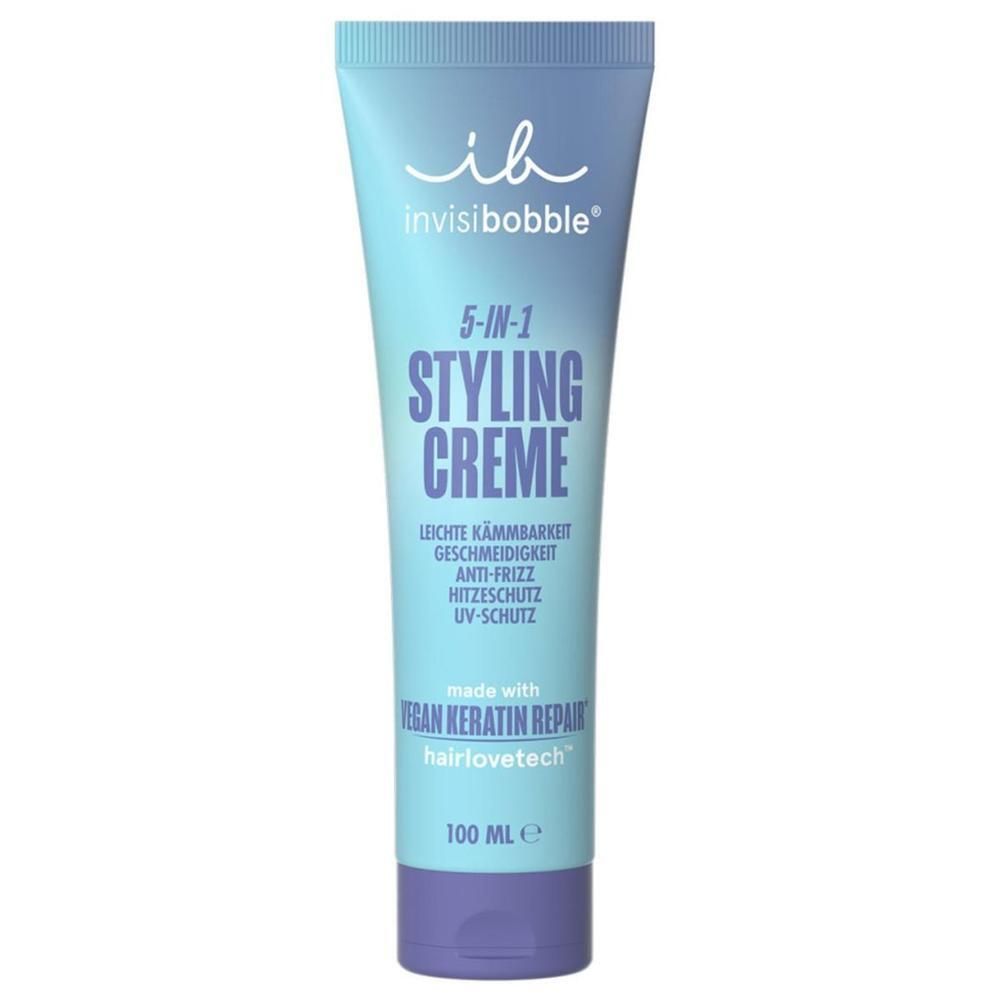 Tube bleu clair avec bouchon violet. Inscription : 5-en-1 Styling Creme, démêlage facile, anti-frisottis, protection thermique, protection UV. Marque : invisibobble.