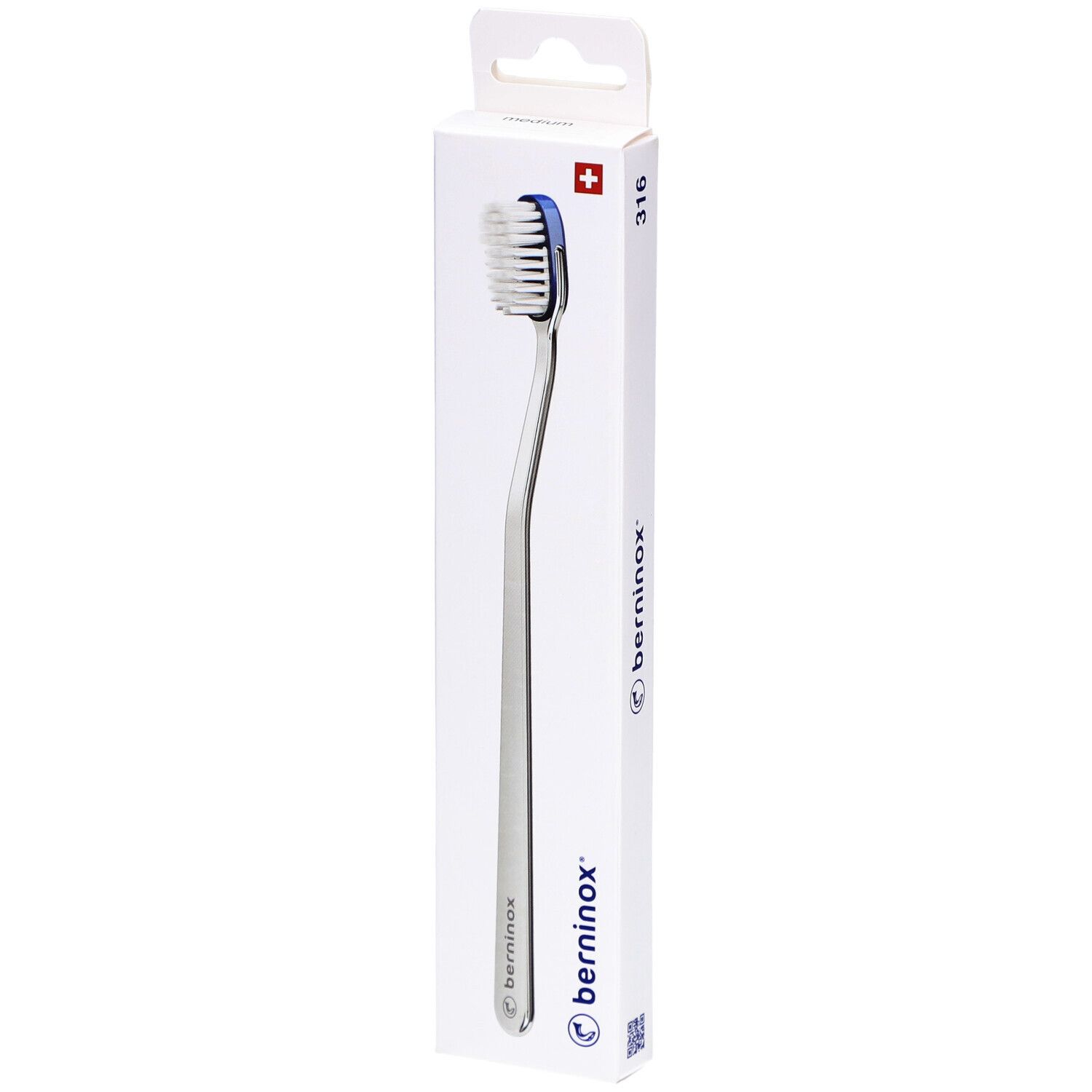Brosse à dents dans son emballage. Boîte blanche avec vue du produit. Croix suisse et logo.