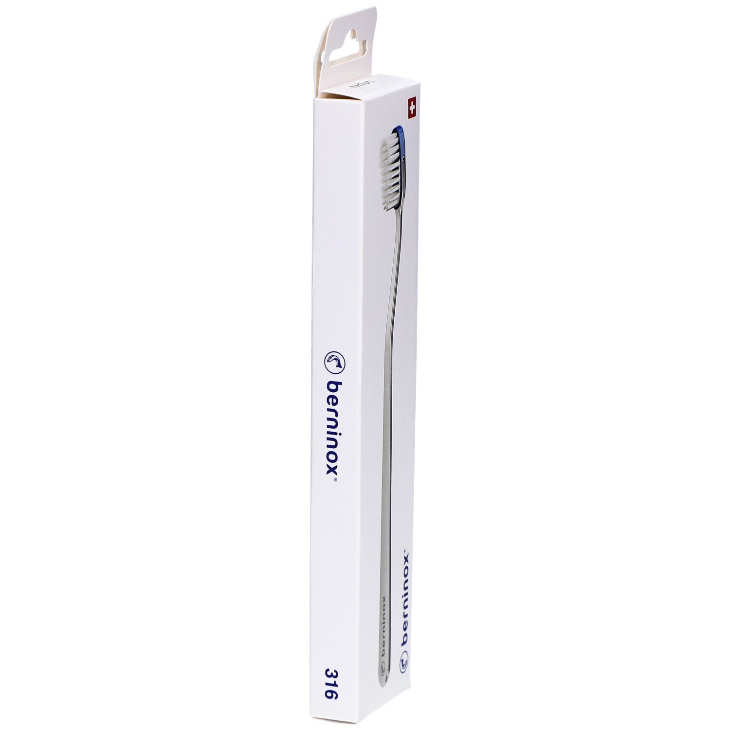 Brosse à dents dans son emballage. Vue latérale de la boîte blanche avec logo et texte.