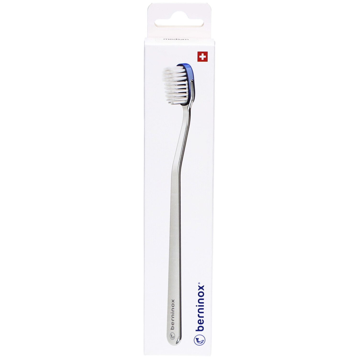 Brosse à dents avec accent bleu. Manche argenté, tête de brosse blanche, croix suisse.