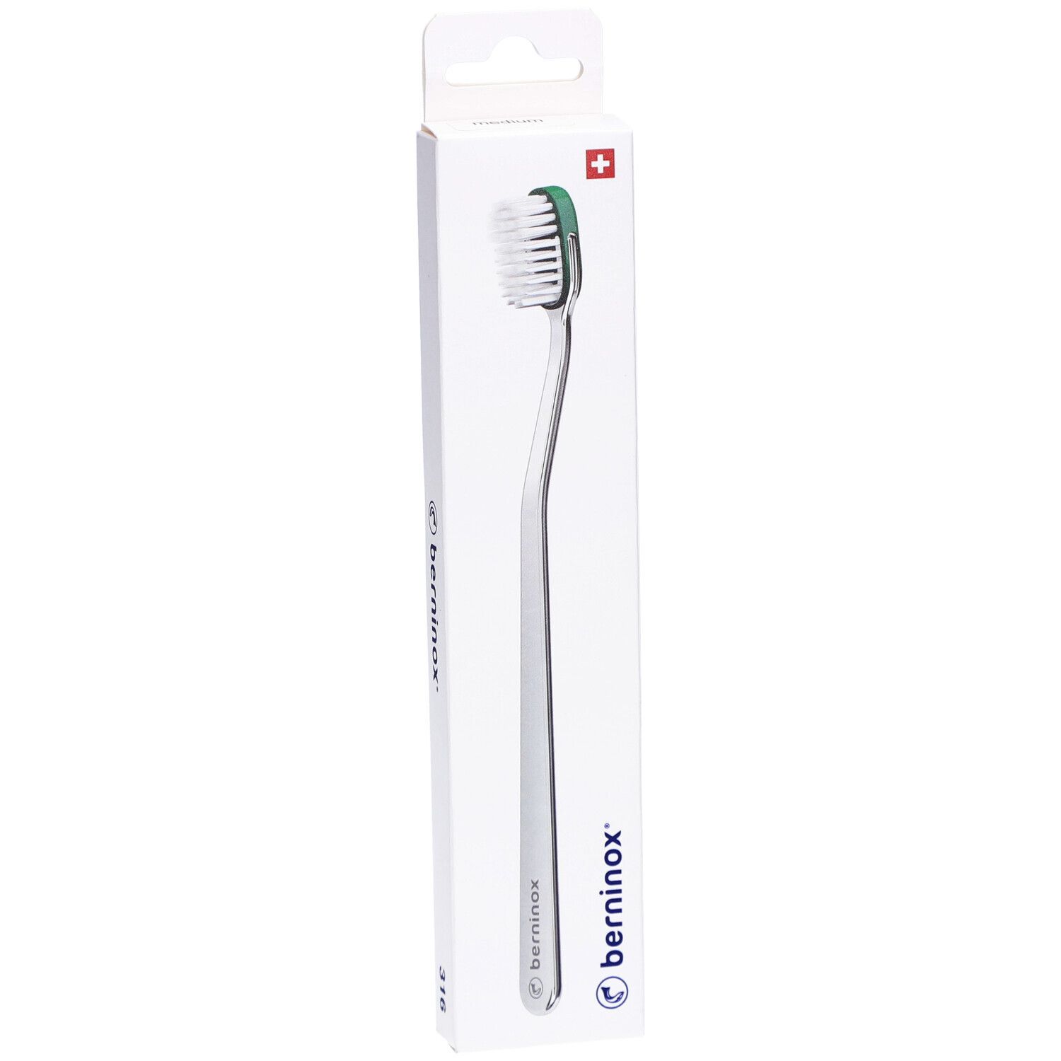 Brosse à dents dans son emballage. Manche argenté, tête verte et blanche. Marque Berninox.