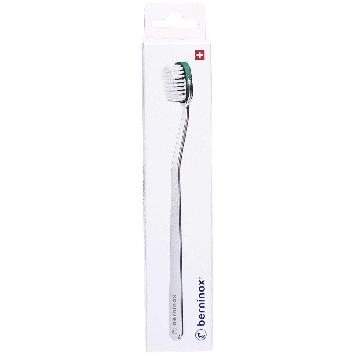 Brosse à dents Atlantikgrün Super Soft dans son emballage. Manche argenté, tête verte et blanche. Croix suisse.