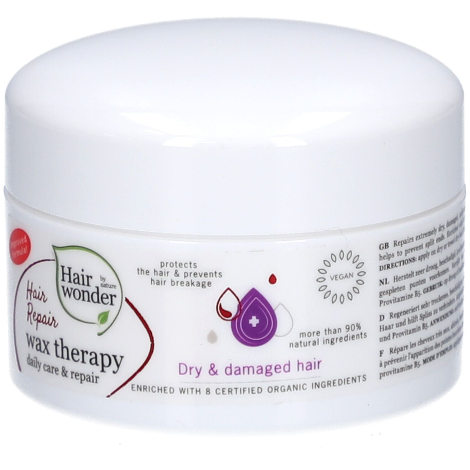 Pot blanc avec étiquette rouge. Inscription : Hairwonder Wax-thérapie. Contient de la phytokératine et de la provitamine B5. Pour cheveux secs et abîmés.