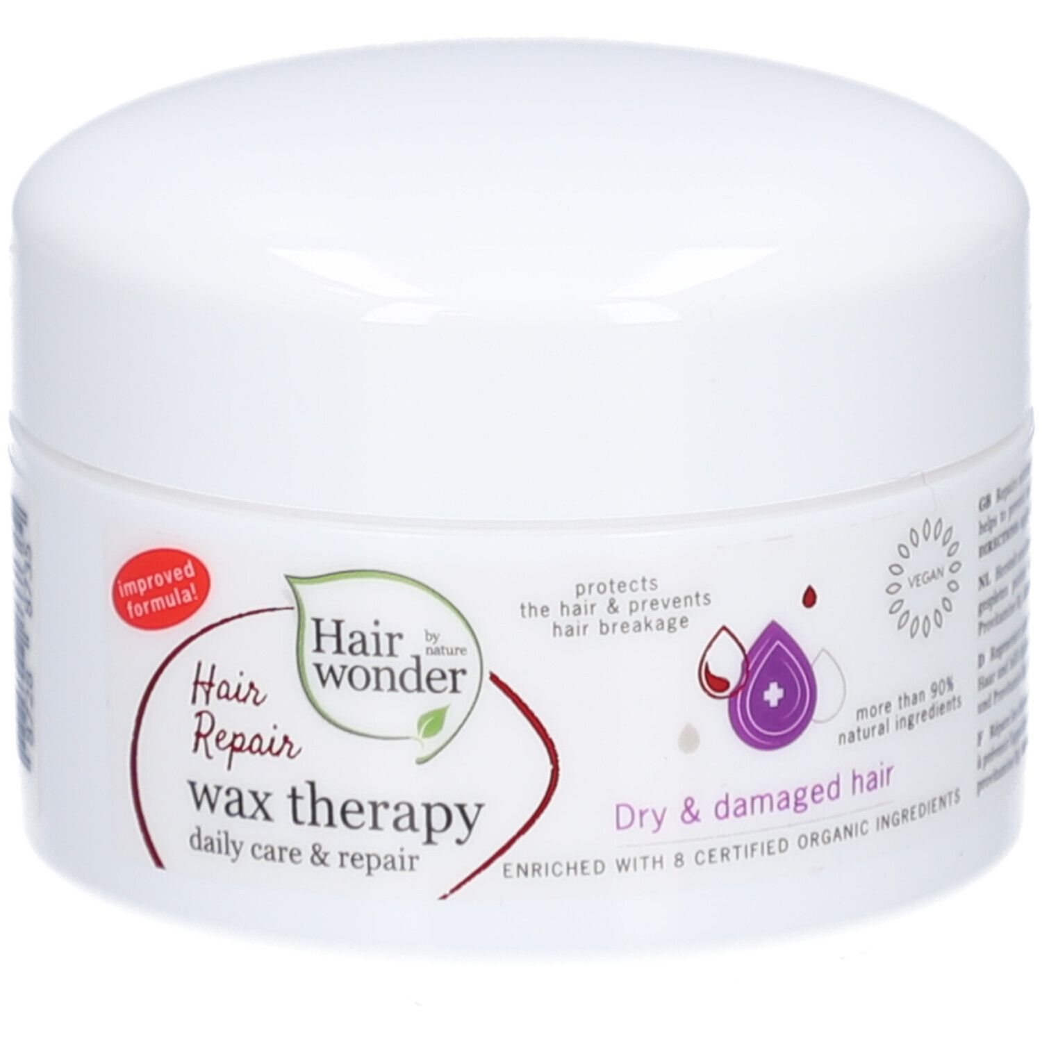 Pot blanc avec étiquette rouge. Inscription : Hairwonder Wax-thérapie. Contient de la phytokératine et de la provitamine B5. Pour cheveux secs et abîmés.