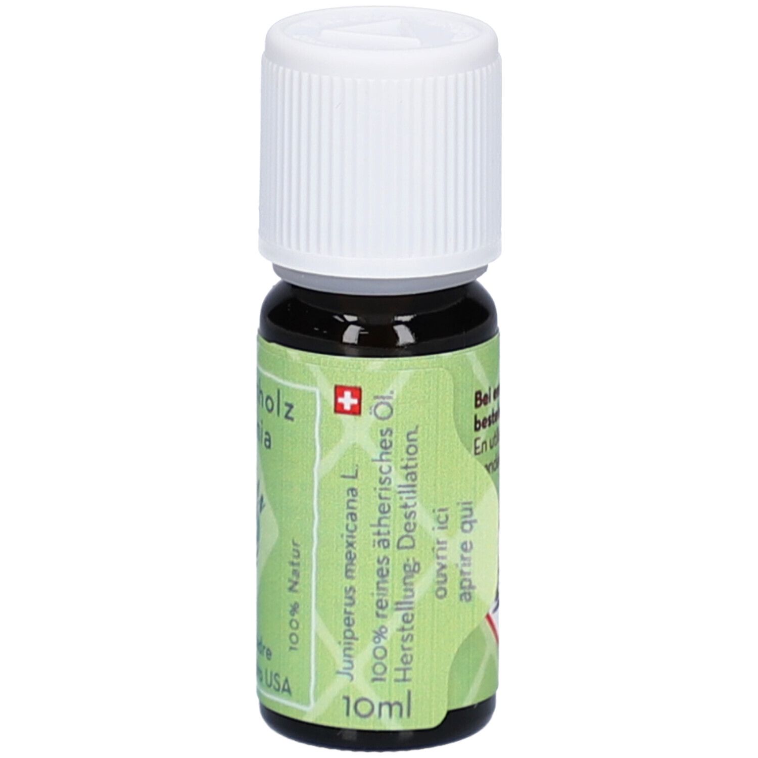 Flacon en verre brun avec bouchon à vis blanc, 10ml. Étiquette verte avec croix suisse et texte.