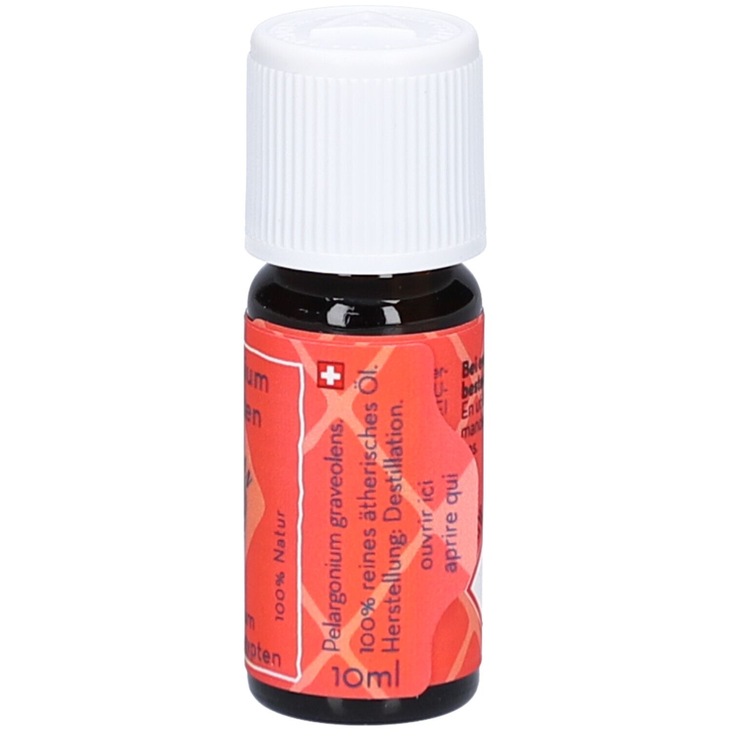 Flacon en verre brun avec bouchon blanc. Étiquette rouge avec texte: Pelargonium graveolens, 100% huile essentielle pure, 10ml.