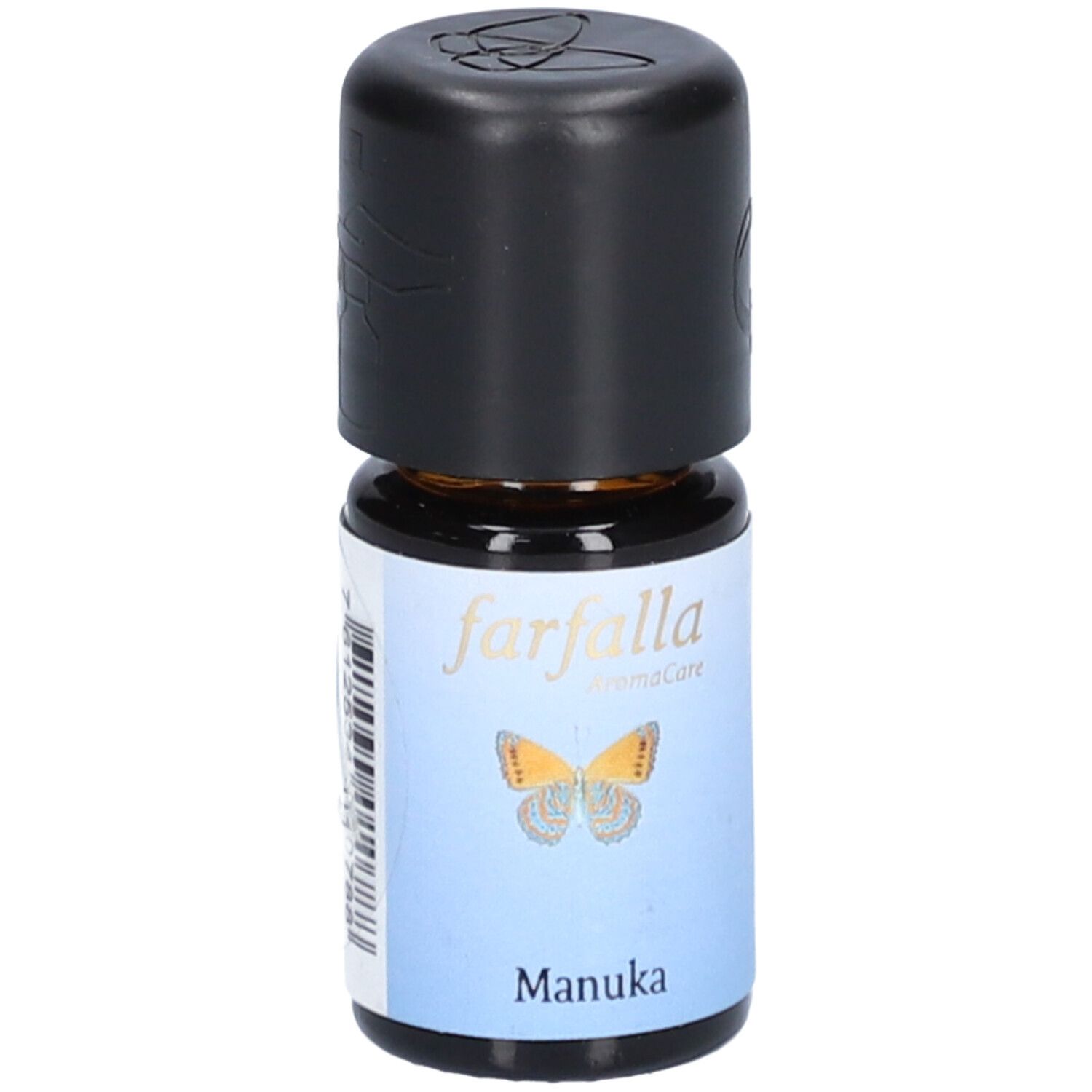 Flacon en verre brun avec bouchon noir. Étiquette avec papillon et texte "Manuka".