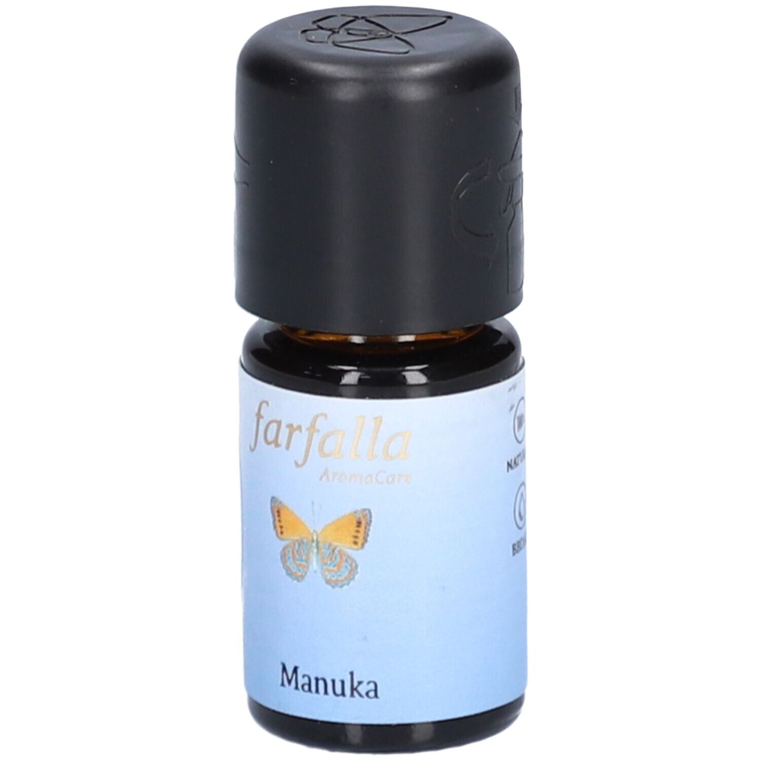 Flacon en verre brun avec bouchon noir. Étiquette avec papillon et texte "Manuka".