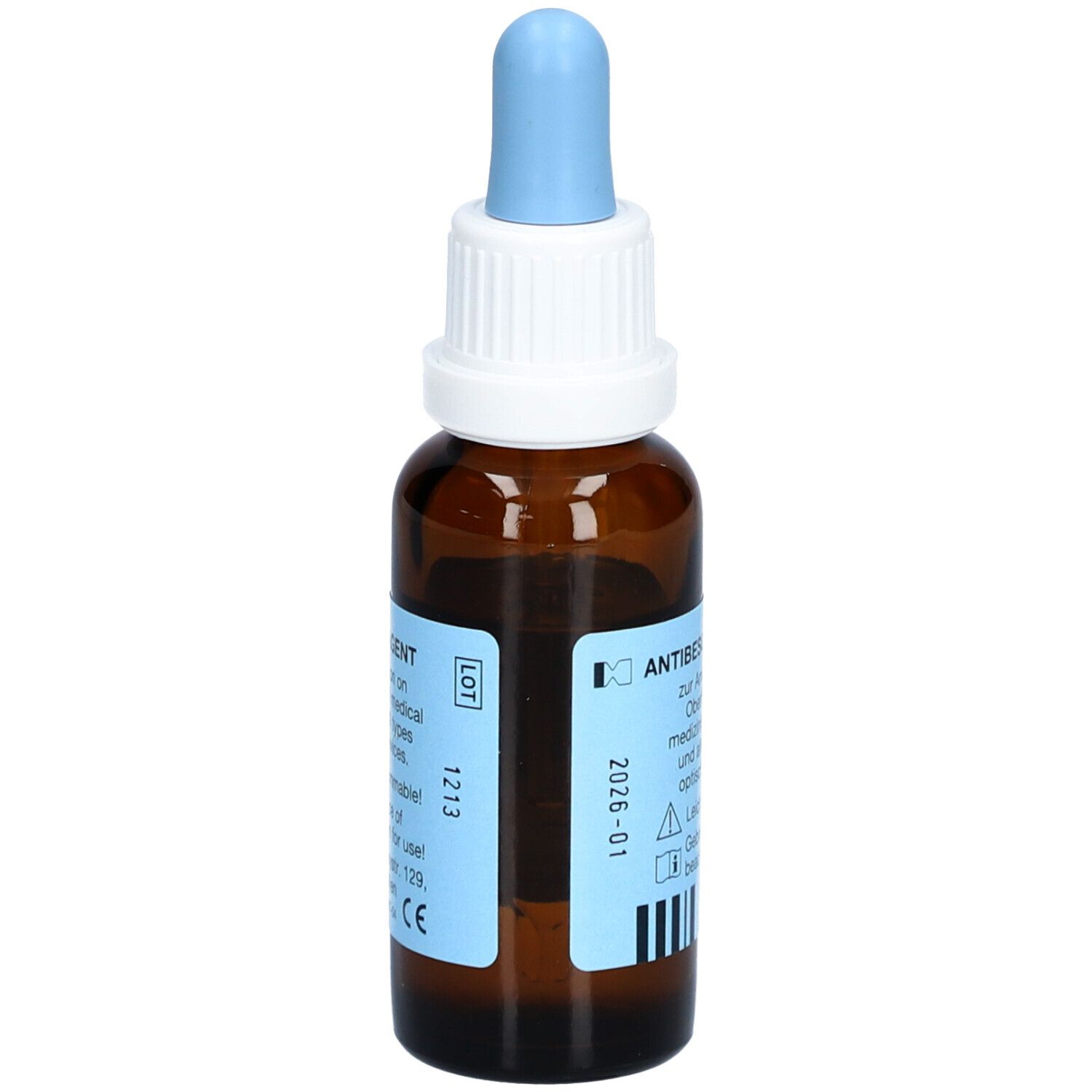 Flacon brun avec pipette bleue. Étiquette avec texte et numéro de lot 1213, date d'expiration 2026-01.