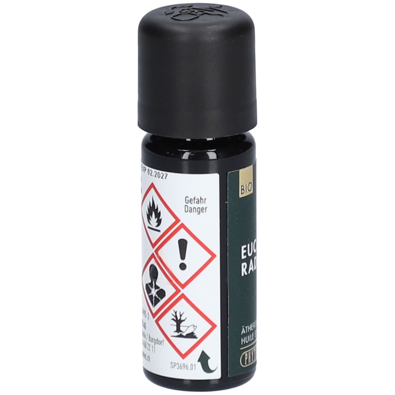 Flacon en verre brun avec bouchon noir. Avertissements et inscription: Danger, Eucalyptus Radiata, Huile essentielle. Marque: PHYTOMED.