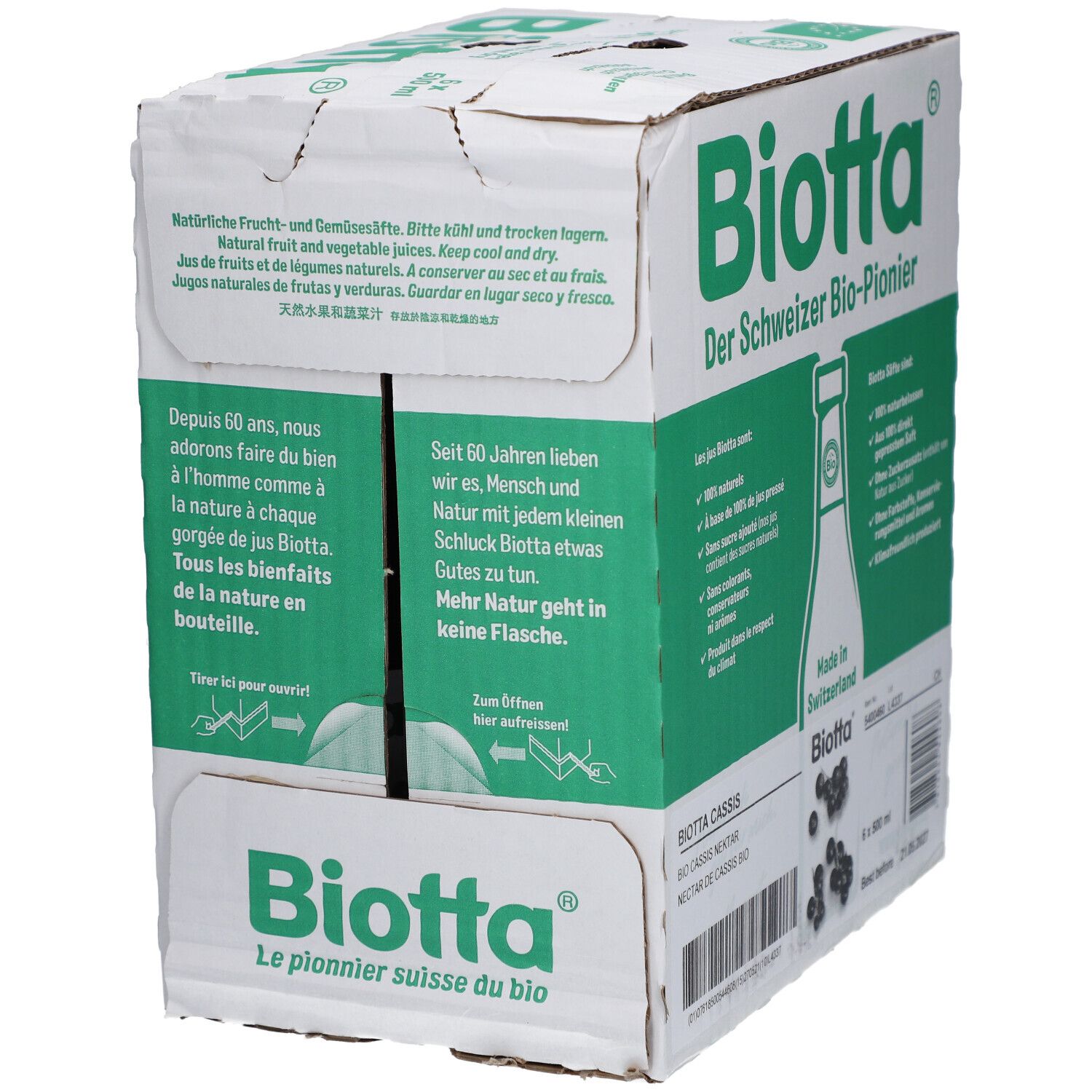 Carton avec logo BIOTTA. Texte : "Der Schweizer Bio-Pionier". Contient des informations sur les jus de fruits et de légumes naturels. Inscription : "Made in Switzerland".