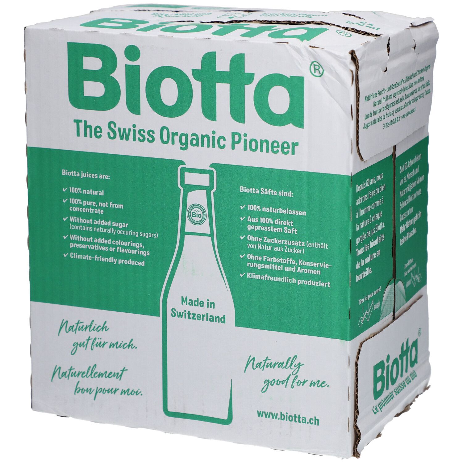 Carton avec logo BIOTTA et texte : "The Swiss Organic Pioneer". Contient des informations sur les jus bio. Inscription : "Made in Switzerland".