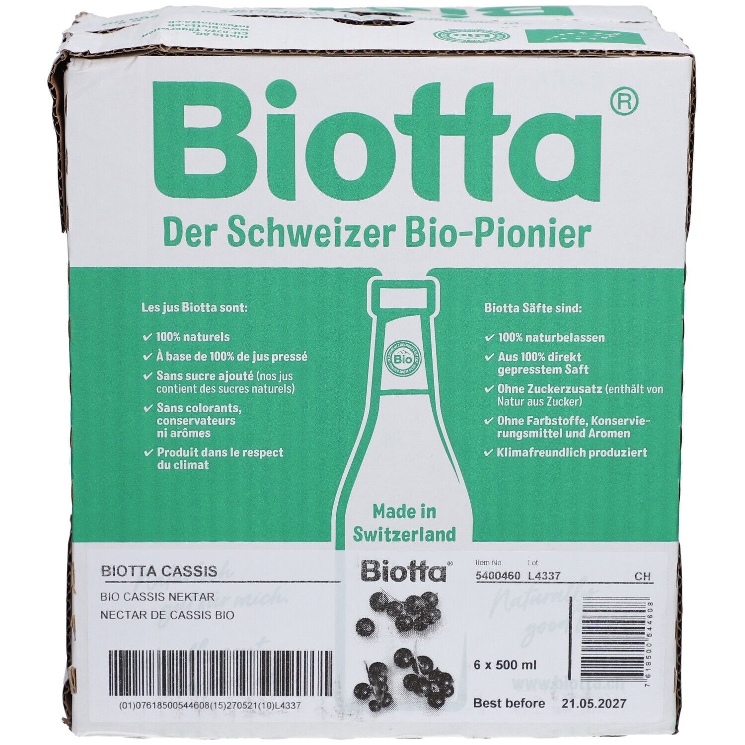 Carton avec logo BIOTTA et informations produit. Contient 6 bouteilles de nectar de cassis. Inscriptions : "Der Schweizer Bio-Pionier", "Made in Switzerland".