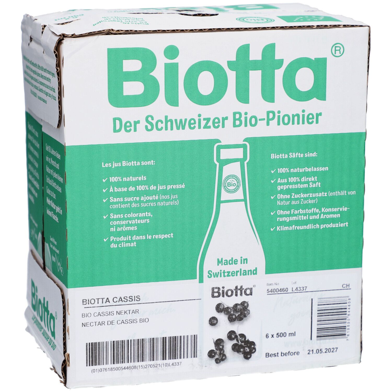 Carton avec logo BIOTTA et informations produit. Contient 6 bouteilles de nectar de cassis. Inscriptions : "Der Schweizer Bio-Pionier", "Made in Switzerland".