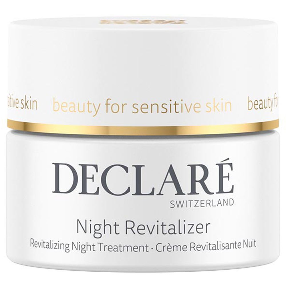 Pot blanc avec bord doré. Inscription : DECLARÉ, Night Revitalizer. Texte : Revitalizing Night Treatment.