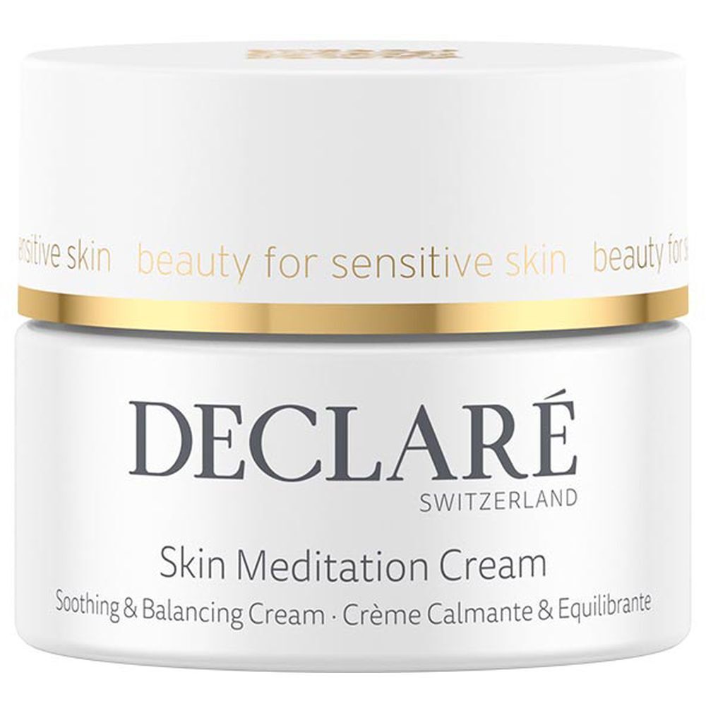 Pot de crème blanc avec bord doré. Inscription : DECLARÉ, Skin Meditation Cream. Texte : Soothing & Balancing Cream.
