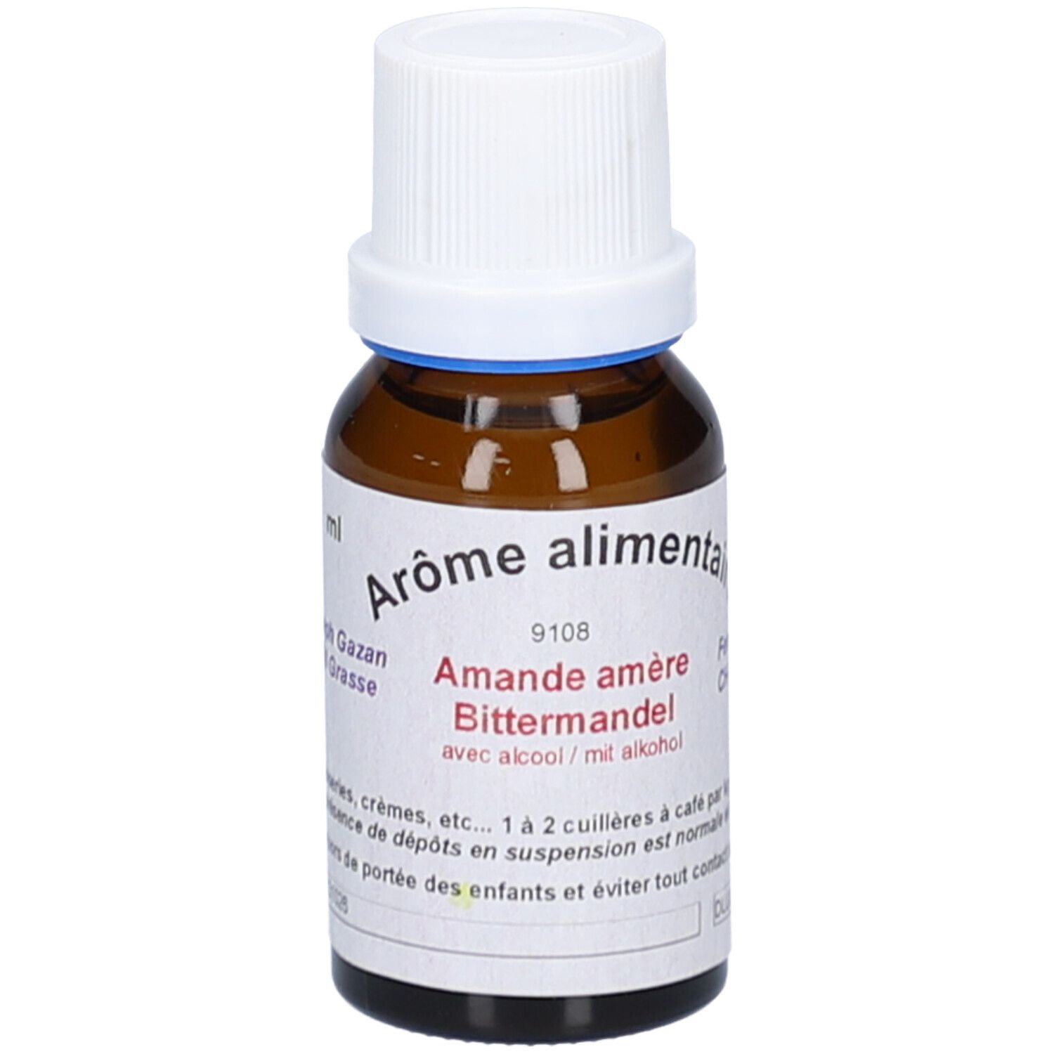 Flacon en verre brun avec bouchon blanc. Étiquette avec texte: Arôme alimentaire, Amande amère, avec alcool. Anneau bleu au col.