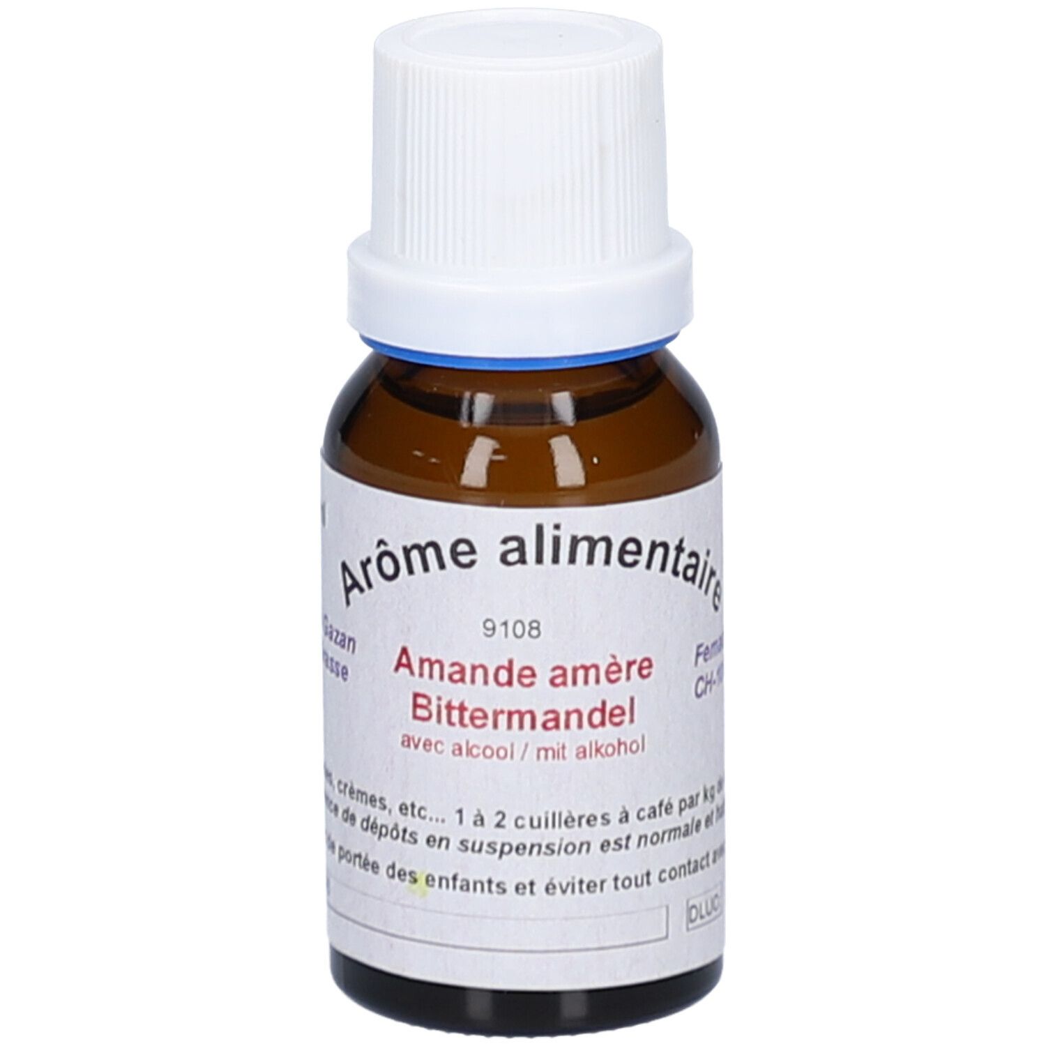 Flacon en verre brun avec bouchon blanc. Étiquette avec texte: Arôme alimentaire, Amande amère, avec alcool. Anneau bleu au col.
