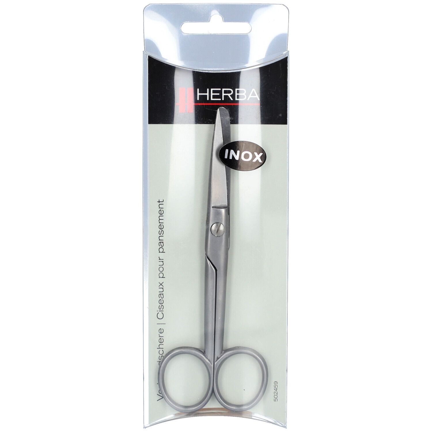 Ciseaux à pansement en acier inoxydable dans un emballage blister. Visible : HERBA, INOX. Ciseaux à bouts arrondis.
