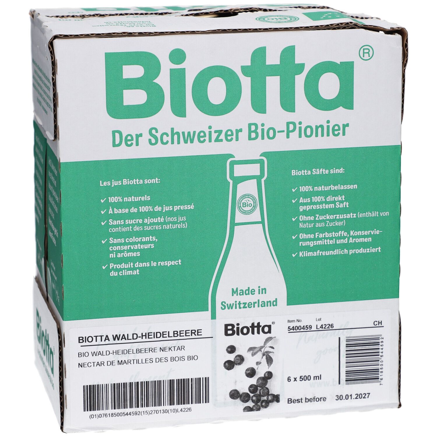 Carton de BIOTTA Waldheidelbeere Bio. Six bouteilles, emballage vert et blanc. Texte: Le pionnier bio suisse. Étiquette produit.