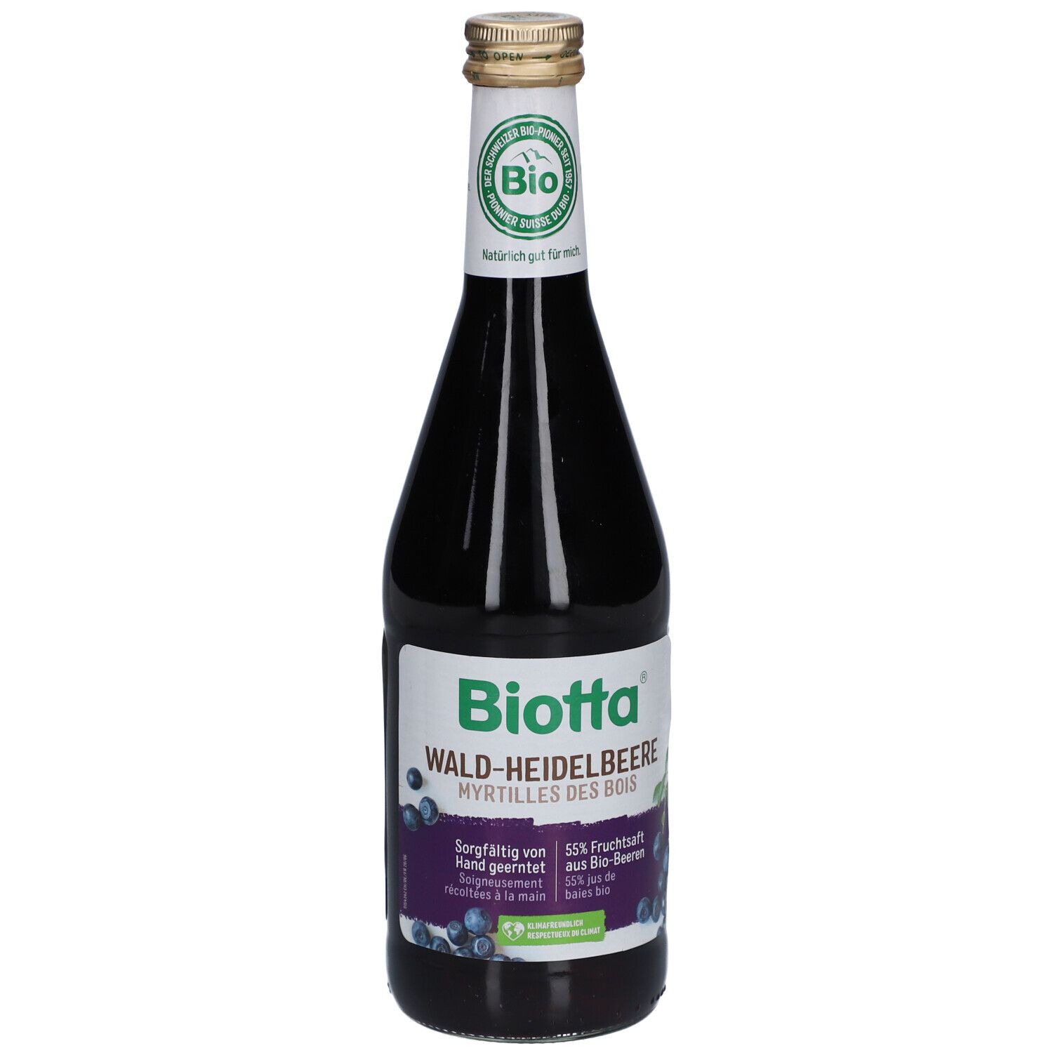 Bouteille en verre avec étiquette "Biotta Wald-Heidelbeere". Label bio et bouchon doré. Jus violet foncé visible.