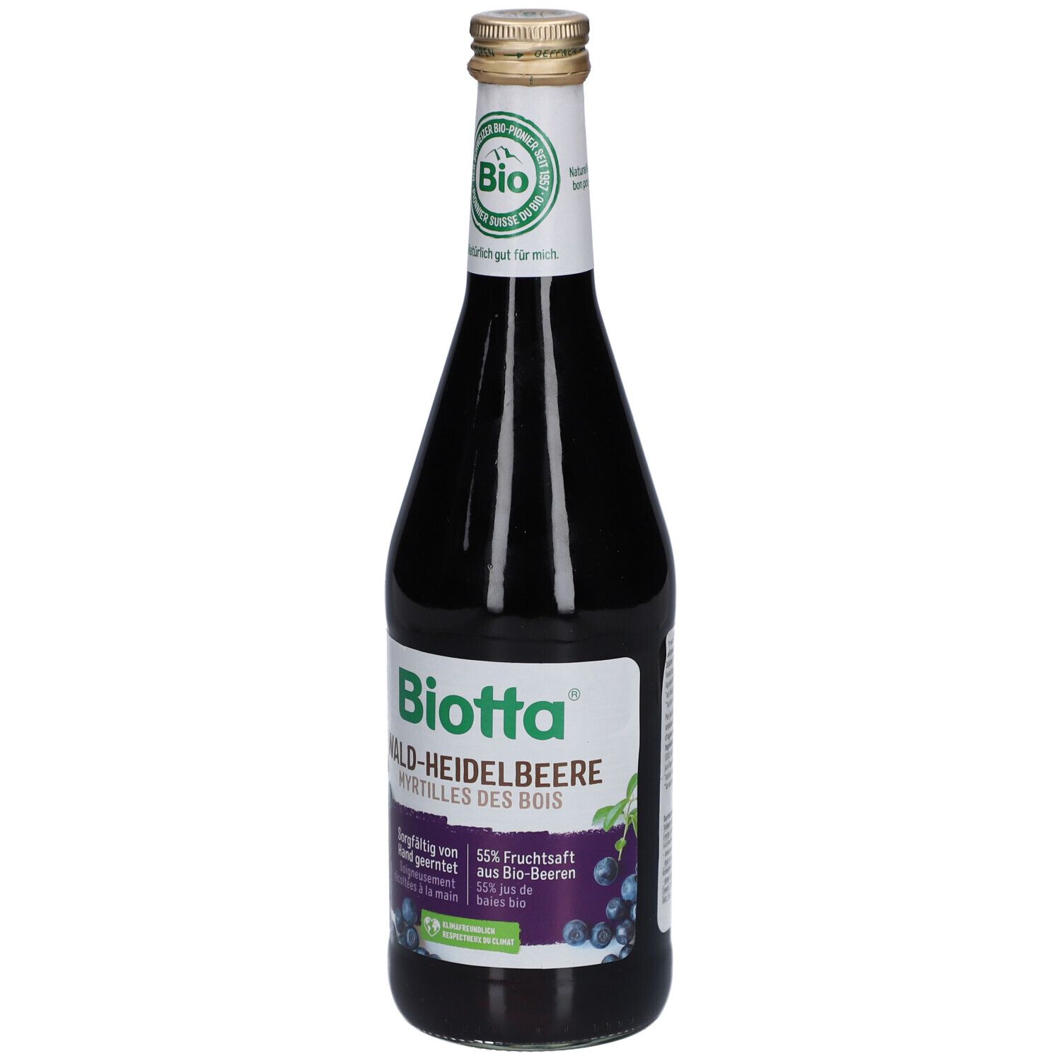 Bouteille en verre avec étiquette "Biotta Wald-Heidelbeere". Label bio et bouchon doré. Jus violet foncé visible.