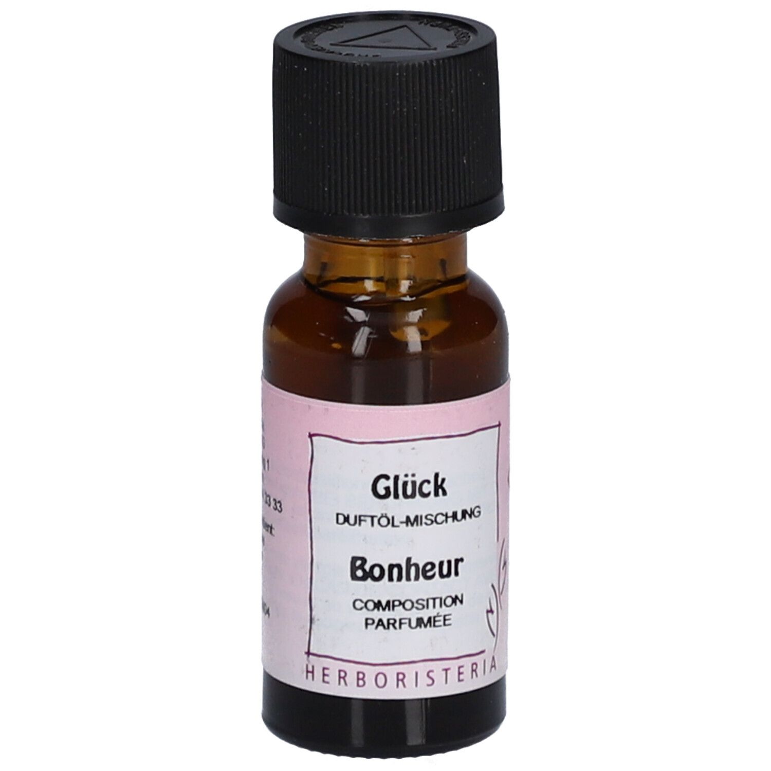 Flacon en verre brun avec bouchon noir. Étiquette avec texte: Glück, Duftöl-Mischung, Bonheur, Composition Parfumée. Marque: HERBORISTERIA.