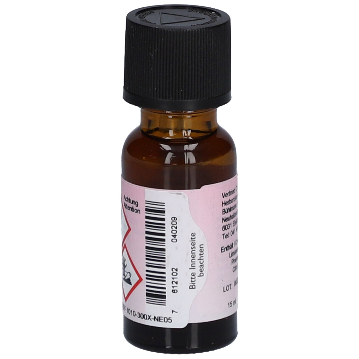 Flacon en verre brun avec bouchon noir. Étiquette avec symboles de danger et texte. Volume: 15 ml. Numéro de lot: 040209.