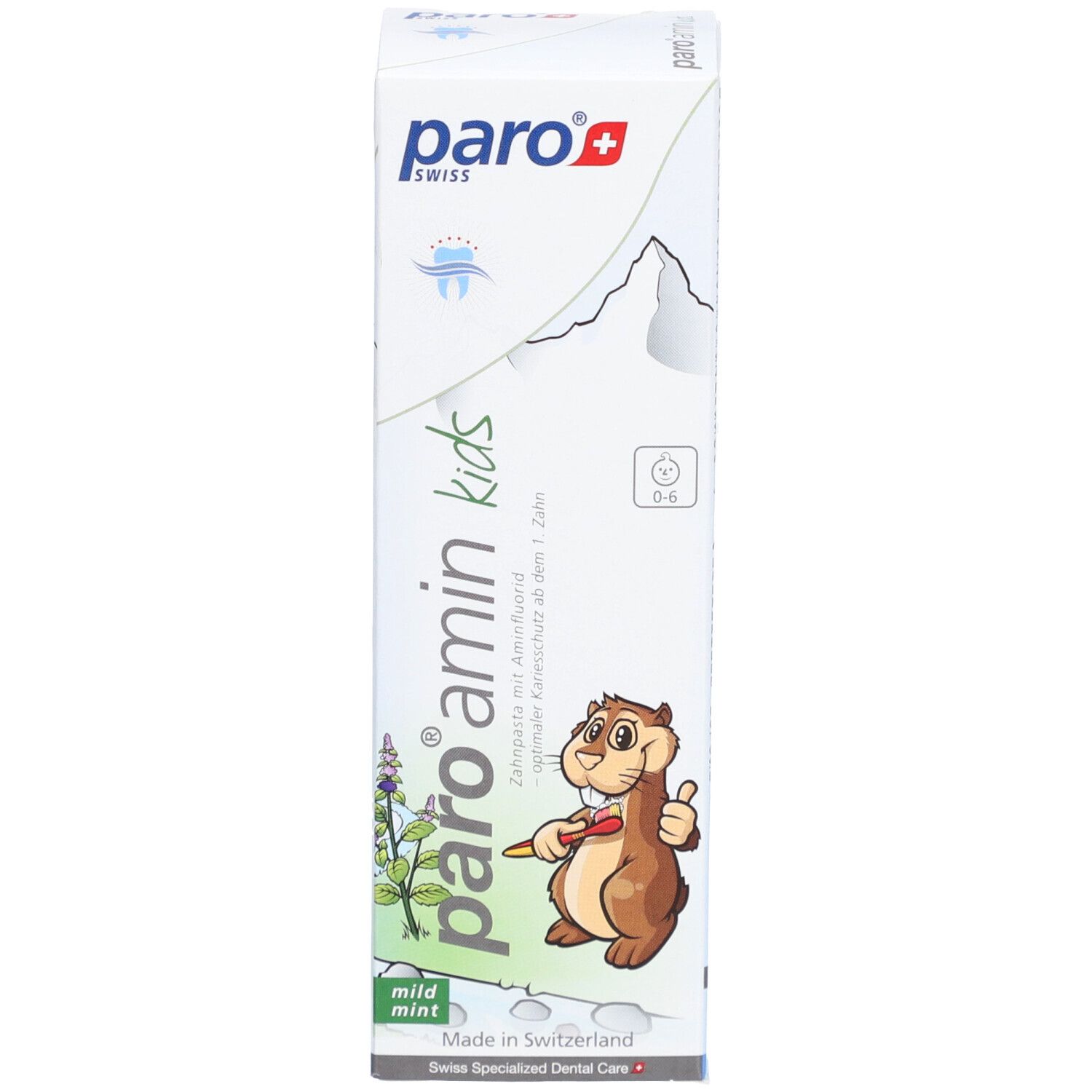 Boîte de dentifrice. Logo et nom du produit. Illustration d'un écureuil. Texte : Amin Kinder Zahnpasta Menthe 0-6 Jahre. Fabriqué en Suisse.