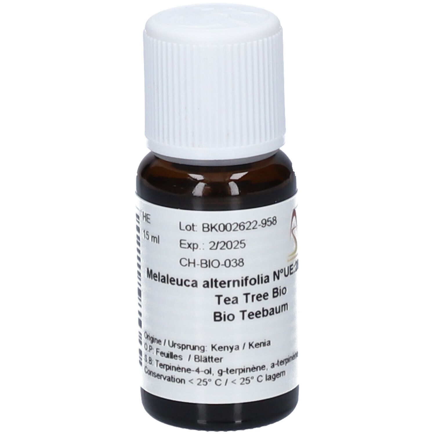 Flacon en verre brun avec bouchon blanc. Étiquette avec texte: Melaleuca alternifolia, Tea Tree Bio, Bio Teebaum. DDM 2/2025.