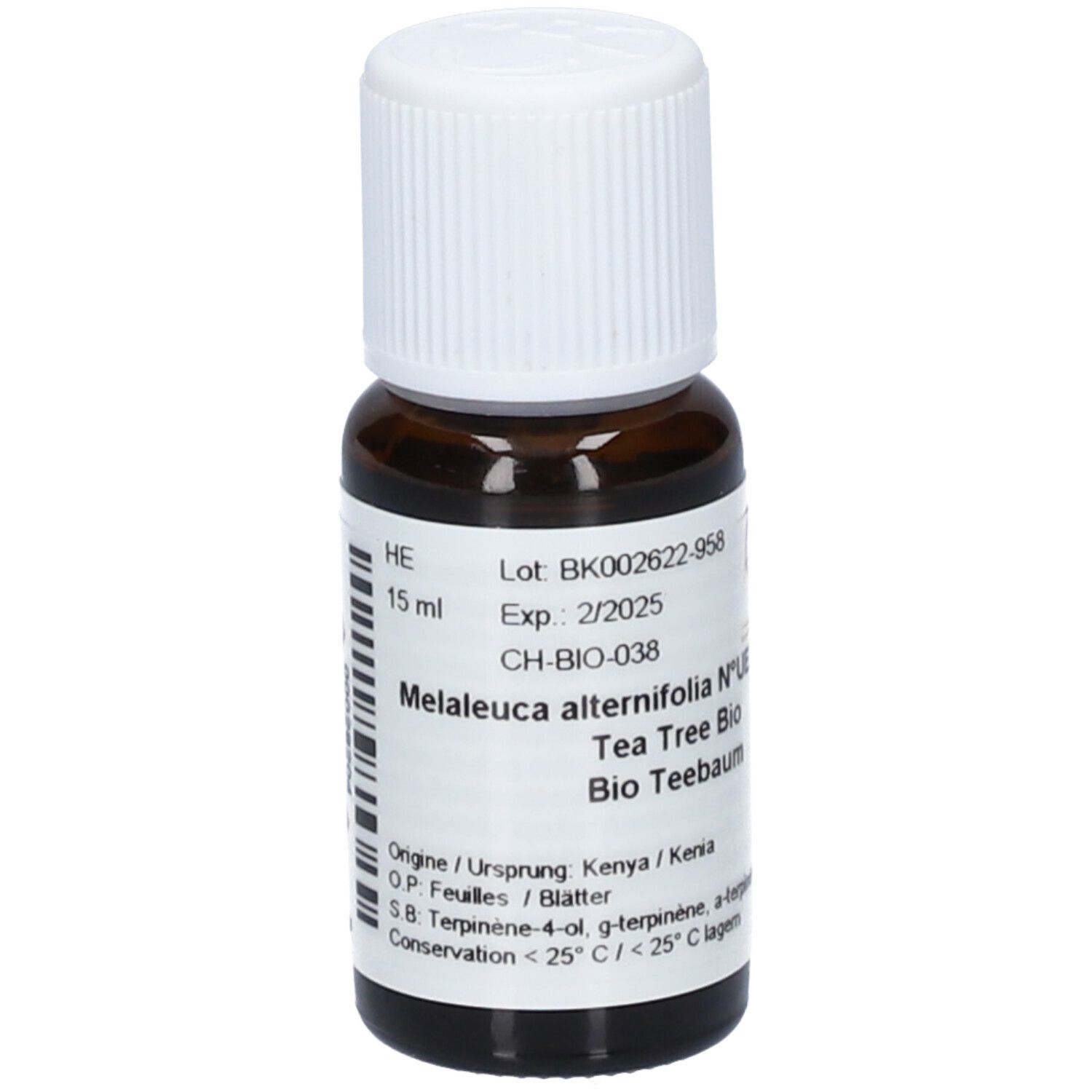 Flacon en verre brun avec bouchon blanc. Étiquette avec texte: Melaleuca alternifolia, Tea Tree Bio, Bio Teebaum. DDM 2/2025.