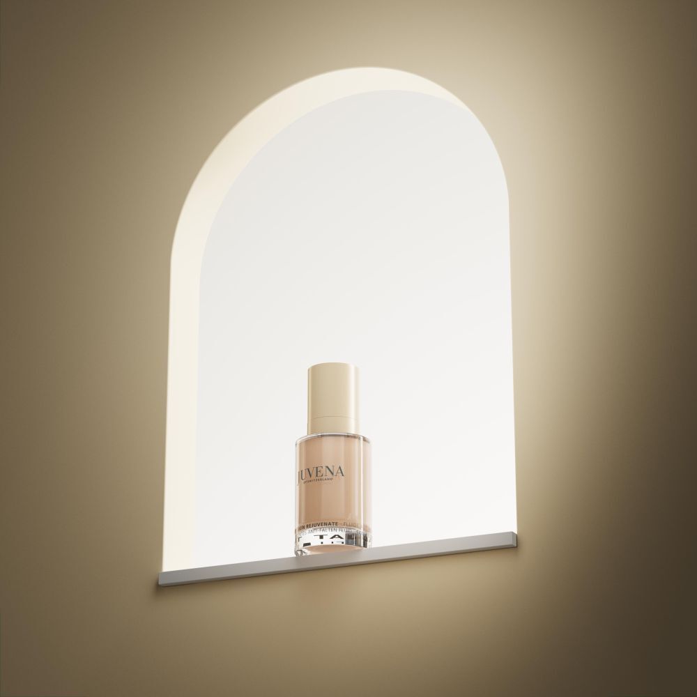 Fluide Teinté Delining Juvena SPF 10, flacon dans une niche.